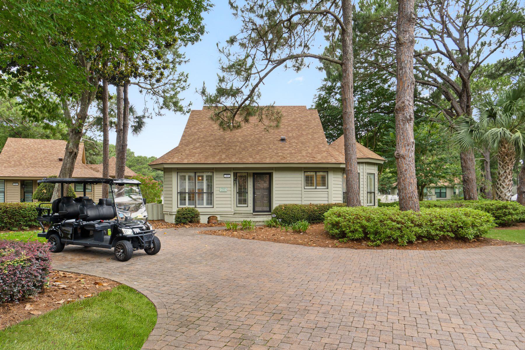 Quite possibly one of the most desirable settings within The Fairways, this lakefront Sandestin Golf and Beach Resort residence enjoys sweeping views across the lake, golf course and bay beyond. Positioned to capture both sunrise and sunset reflections across the water, the home offers a peaceful backdrop rarely found within the community.

Thoughtfully updated and exceptionally maintained, this three-bedroom villa lives noticeably larger than many comparable Fairways residences thanks to its enclosed waterfront sunroom. Surrounded by expansive windows and natural light, the additional living space serves as a second sitting area, game room, reading retreat, home office, or overflow sleeping space for guests.

Designed for effortless coastal living, the home seamlessly blends indoor and outdoor spaces. A spacious Trex deck overlooks the lake and golf course, while a second-floor balcony provides an elevated vantage point of the surrounding scenery. Just beyond, a private dock area creates the perfect setting for morning coffee, evening cocktails, or simply enjoying the tranquil waterfront setting.

Inside, the open-concept floor plan is both functional and inviting. The kitchen flows naturally into the dining and living areas, creating an ideal environment for entertaining family and friends after a day at the beach, golf course, marina, or Baytowne Wharf. Plantation shutters, porcelain tile plank flooring, luxury vinyl plank flooring, updated bathrooms, a separate laundry room, and exterior storage contribute to the home's polished yet comfortable feel.

The bedroom layout offers exceptional flexibility, with two bedrooms conveniently located on the first floor and a private primary suite upstairs. Combined with the enclosed sunroom, the home comfortably accommodates larger groups, enhancing both everyday enjoyment and rental potential.

Significant improvements provide peace of mind, including a 2022 roof and 2017 HVAC system. A six-passenger golf cart, added in 2024, is included with the sale and offers easy access throughout the resort.

Ownership within Sandestin Golf and Beach Resort places residents in the heart of one of the Emerald Coast's premier resort communities. Spanning approximately 2,400 acres from the Gulf of Mexico to Choctawhatchee Bay, Sandestin offers four championship golf courses, tennis and pickleball facilities, a 226-slip marina, fitness center, spa, resort pools, more than seven miles of beach frontage, miles of golf cart and pedestrian paths, and the vibrant dining, shopping and entertainment venues of The Village of Baytowne Wharf and Grand Boulevard. Residents also enjoy the convenience of nearby grocery stores, everyday services, Sacred Heart Hospital on the Emerald Coast, and a wide variety of medical specialists and healthcare facilities, allowing owners to enjoy resort living without sacrificing access to essential amenities.

Whether utilized as a primary residence, second home, or investment property, this exceptional waterfront villa presents a rare opportunity to enjoy one of the most captivating views within The Fairways.