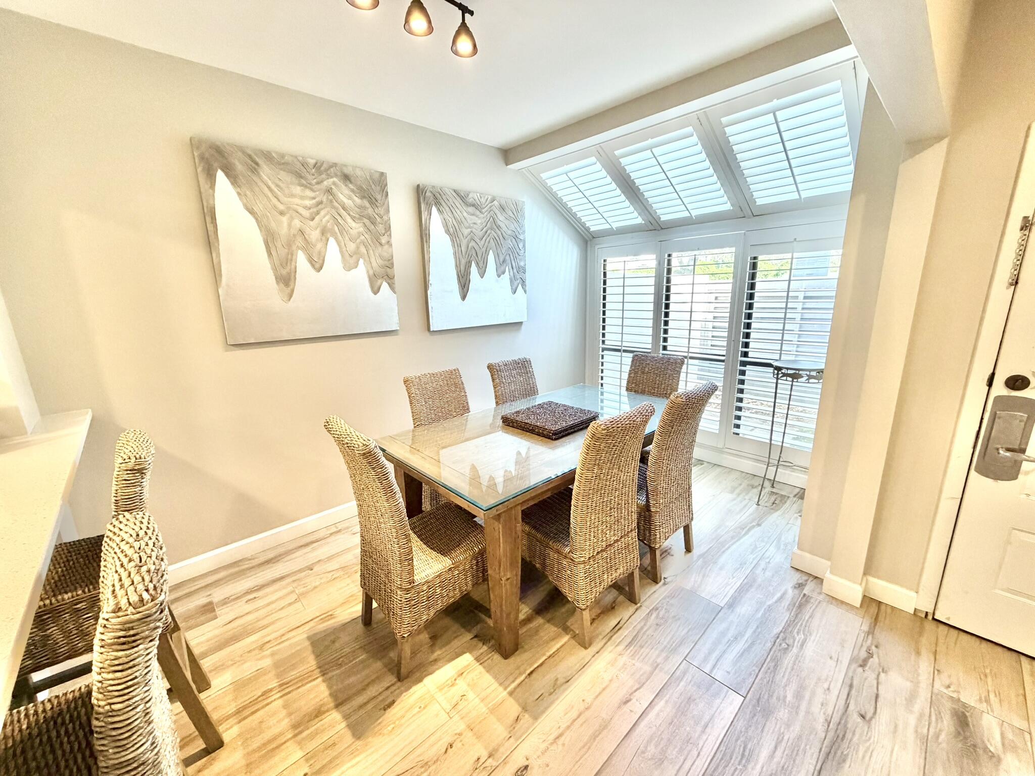 From the moment you step inside, it's clear this Beachwalk townhome is something special. 5163 Beachwalk has been lovingly maintained and updated from top to bottom, featuring the distinctive details of crown molding in the living room, bedrooms & baths, plus plantation shutters, upgraded two-panel doors, and stylish hardware throughout. The kitchen boasts stainless steel appliances, upgraded cabinets, quartz countertops, and not one, but two bar seating areas. And wait until you see the bathrooms--fully tiled walls with decorative accent bands, custom vanities topped with hand-picked granite & sleek undermount sinks. Step outside and relax on your patio while taking in the serene view of Horseshoe Lake beneath the shade of a magnificent live oak. All that is missing is you, so call today!