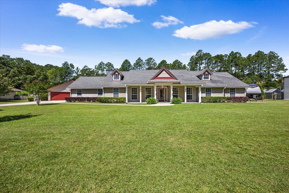 ** PRICE IMPROVEMENT to $450,000 ** Roof will be replaced with an acceptable offer** Welcome to a comfortable country retreat tucked into the highly desired Waterview Estates of Milton, Florida. From the moment you arrive, this 4-bedroom, 3-full-bath home invites you to slow down, breathe deep, and settle in -- offering 2,476 square feet of easy, relaxed living on a peaceful, canal-front lot.

Step inside to find generous space for the everyone, the bedrooms have been thoughtfully arranged for everyday comfort and weekend gatherings alike. The attached two-car garage keeps daily life simple and organized, while the true magic of this property waits just out the back door.Approximately 180 feet of waterfront line a calm, shallow canal that is tailor-made for kayaking and paddle boarding right from your own backyard. A voluntary HOA grants access to the community dock and boat launch, opening the door to sun-soaked days out on the bay whenever the mood strikes.

Hobbyists, makers, and outdoor enthusiasts will fall in love with the detached 612-square-foot garage, currently used as a workshop. It features a functional half bath already plumbed for a shower, making a future full-bath conversion a simple upgrade. A covered cement pad on the south side offers the perfect spot to park a boat, while the north side boasts a screened-in porch complete with a built-in bartop and direct access to that half bath -- an ideal place to gather and unwind after a day on the water. A portion of the backyard is enclosed with a chain-link fence, giving pets a safe, secure space to roam outdoors unattended. On the north side of the property, a cement pad with a 30-amp hookup stands ready to welcome and power a recreational vehicle -- perfect for the traveler at heart.

Best of all, this comfortable country setting never asks you to give up convenience. You are just minutes from Interstate 10 and Whiting Field, with an easy drive to the sugar-white sands of Pensacola Beach and all the restaurants and shopping you could want close at hand. It is the rare property that delivers room to breathe, space to play, and connection to everything you need.
Country comfort, waterfront living, and unbeatable convenience -- 3171 Waterview Drive is ready to welcome you home.