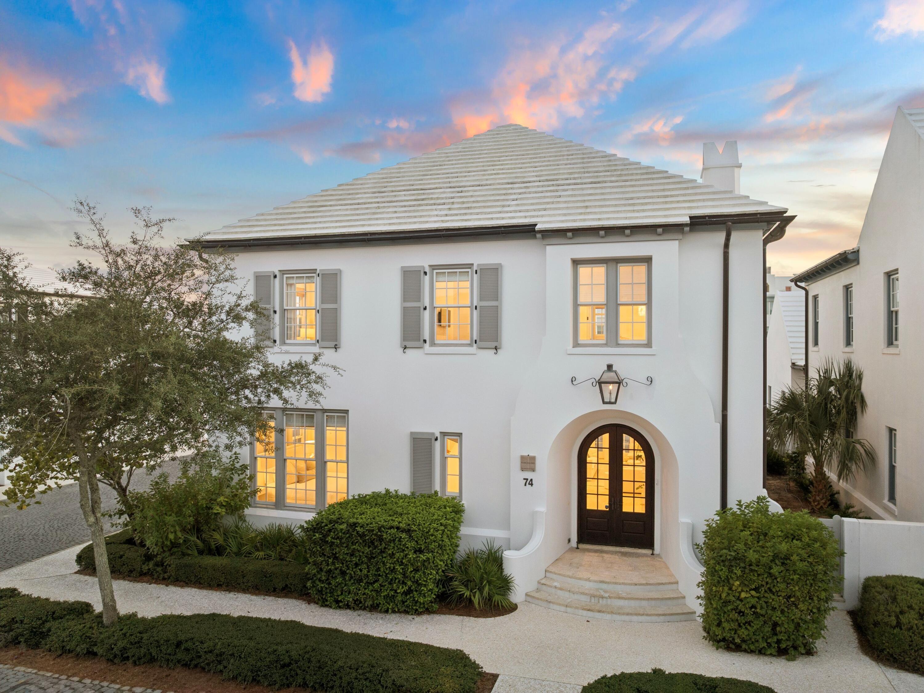 Set within one of South Walton's most sought-after coastal enclaves, 74 Nonesuch Way is a sophisticated residence by T.S. Adams Architects, pairing timeless Mediterranean-inspired architecture with an effortless, light-filled interior. Ideally positioned as an end-cap residence with no shared walls, the 3,197-sq.-ft. home benefits from an exceptional number of windows, filling the living spaces and bedrooms with natural light.

Designed with both everyday living and hosting in mind, the home offers four generously sized full bedrooms, each with windows, plus a dedicated bunk room. A full bedroom on the main level provides added flexibility for guests, while the primary suite and bunk room are among the home's most inviting spaces. The thoughtful bedroom configuration creates true separation and privacy while comfortably accommodating family and guests.

A dramatic arched entry opens to expansive living and dining spaces that feel bright, open, and connected. The generously sized kitchen anchors the main living area with an oversized island, abundant cabinetry and storage, a dedicated pantry, dual-zone wine refrigerator, premium appliances, and new pendant lighting. The kitchen flows naturally into the sunlit dining area and living room, creating one large gathering space centered around a marble fireplace. Throughout the home, recent updates have given the interiors a fresh, collected feel, including new furnishings and artwork, select interior paint, new LED recessed lighting, and updated kitchen pendants. The renovated powder room has become a standout space in its own right, bringing an unexpected design moment to the main level.

The private courtyard extends the living space outdoors with a 42-inch Alfresco grill and hood, fountain feature, and tiled areas for dining and entertaining. Importantly, the courtyard offers ample room to add a private pool, creating the opportunity to further transform the space into a secluded outdoor retreat. Pool renderings are available to help illustrate the potential. A two-car garage, particularly valuable within Alys Beach, adds another layer of everyday functionality.

Additional improvements include a new energy-efficient HVAC system installed in 2025, exterior repainting completed in 2025, and Control4 home automation for climate and lighting, along with additional cabinet and window repairs and replacements completed following purchase.

Offered fully furnished with refreshed furnishings and artwork throughout, 74 Nonesuch Way is a turnkey opportunity that stands apart for the qualities that matter most: an end-cap position, abundant windows and natural light, four true and spacious bedrooms plus a bunk room, a main-level bedroom, expansive kitchen and living spaces, a two-car garage, and a courtyard with room to add a private pool. Moments from the Gulf, it offers a rare combination of space, privacy, and effortless coastal living in Alys Beach.