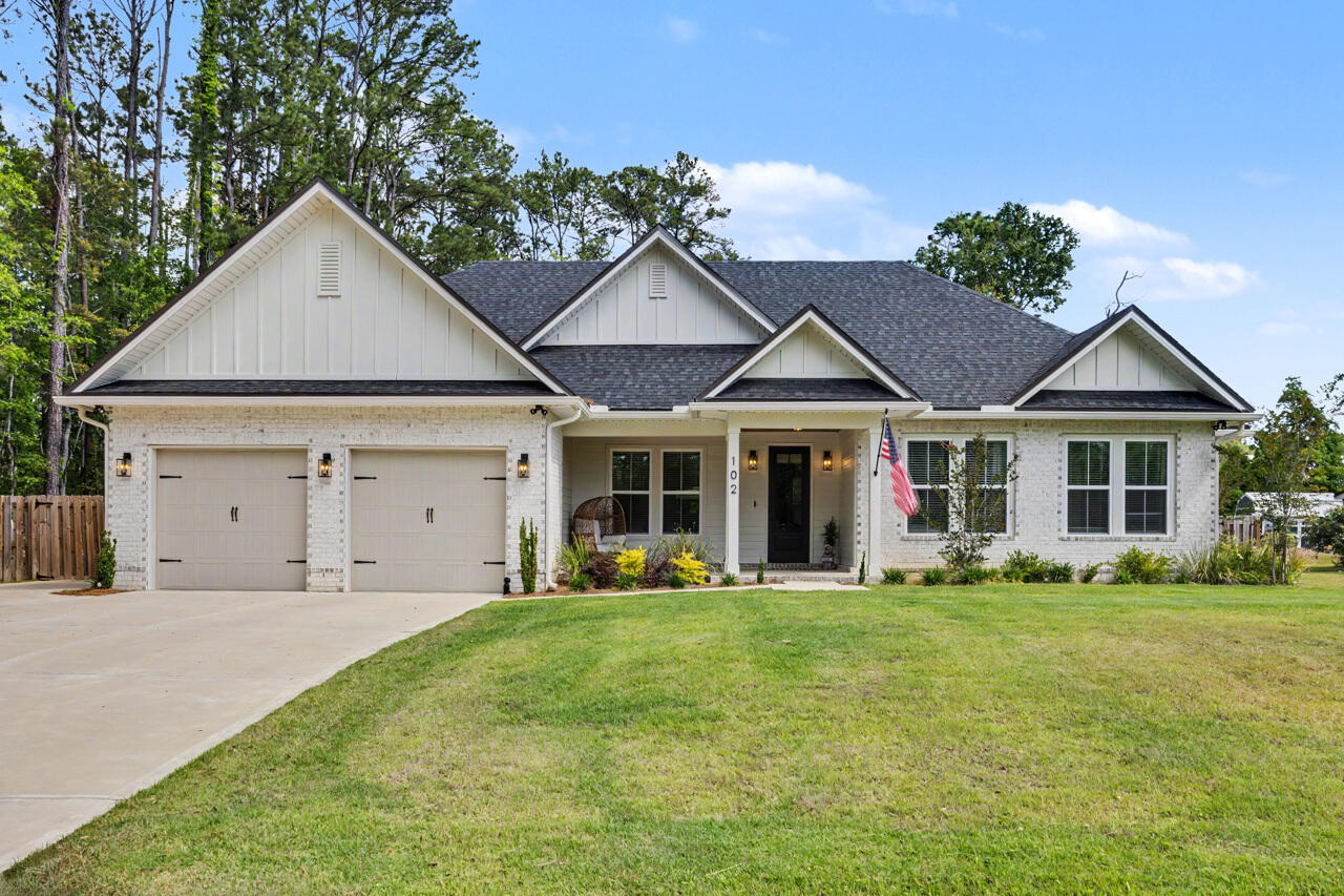Better than new and loaded with custom character, this stunning 2024-built home offers the rare combination of modern construction, thoughtful upgrades, and true privacy-all on a spacious ½-acre lot in the city limits of Freeport with NO HOA.

Featuring 4 bedrooms, 2.5 baths, and 2,068 square feet, this custom-built home stands out from the typical cookie-cutter new construction with upscale finishes, architectural charm, and top-notch craftsmanship throughout. Built for both beauty and efficiency, the home includes foam insulation, a whole-house dehumidifier, and a deep well irrigation system for enhanced comfort and lower maintenance.

Inside, you'll find 10-foot ceilings in the main living areas, a welcoming foyer, formal dining room, and an open-concept layout perfect for entertaining. The designer kitchen flows seamlessly into the living room and features Frigidaire Professional appliances, a walk-in pantry, oversized island, and beautiful custom details.

The private primary suite is a true retreat with two walk-in closets, antique barn doors, and a luxurious en-suite bath featuring a double split vanity plus dedicated makeup vanity. Thoughtful character elements like statement chandeliers, exposed wood accents, and custom finishes create warmth and style rarely found in newer homes.

Step outside to enjoy the large 30' x 10' fully screened back porch with cable/internet hookup, perfect for outdoor lounging or game-day entertaining, along with beautiful tongue-and-groove porch ceilings on both the front and back porches. The expansive fenced backyard offers plenty of room to play, garden, or add a pool. An oversized split 2-car garage provides extra storage and functionality, while the quiet no-through street offers added privacy and minimal traffic.

All of this just minutes from everything:
Quick access to Highway 331 for easy commuting
Less than 20 minutes to 30A & South Walton beaches
7 minutes to Grady Brown Park & Choctawhatchee Bay boat launch
Convenient to shopping, dining, schools, and all Freeport amenities

If you've been searching for a nearly new home with personality, space, privacy, and no restrictions, this is the one.