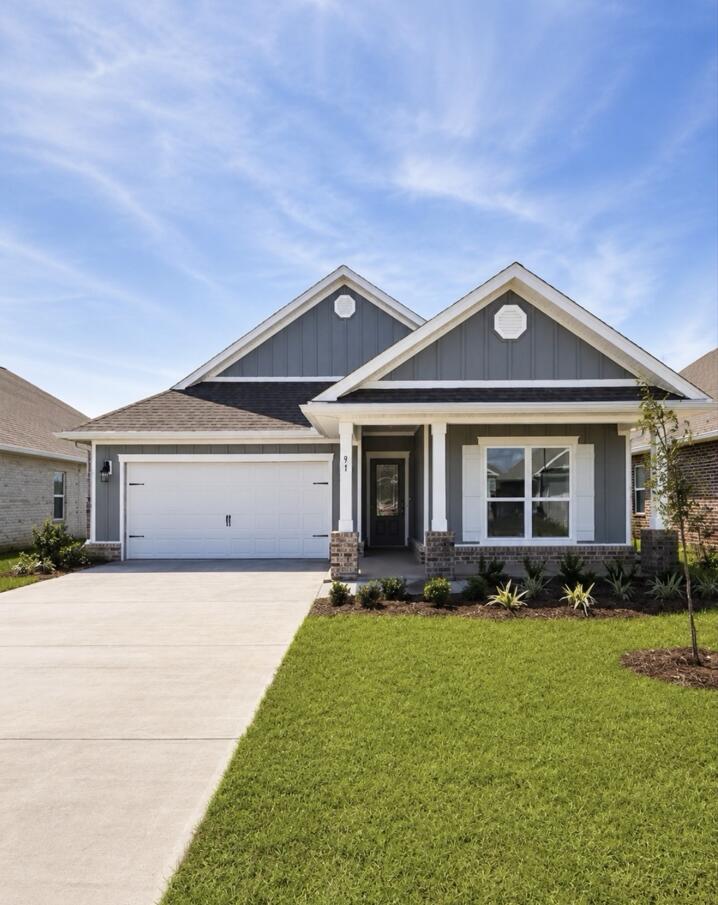 Welcome to 91 Gray Owl Drive E, a new home at Owls Head Farms in Freeport Florida. This home is under construction and features a welcoming and elegant foyer that leads into a spacious open concept living area with 9' ceilings. The kitchen features quartz countertops, Whirlpool stainless steel appliances, and an oversized island, making it the centerpiece of the home. The single basin undermount sink and the dedicated water filter faucet add to the ease in the kitchen. The dining area and great room are flooded with natural light, offering a warm and inviting atmosphere.

The primary bedroom, located at the rear, includes a luxurious bathroom with dual vanities, a walk-in shower, separate soaking tub, and a spacious closet. Images are of a similar Riverside floor plan at completion.