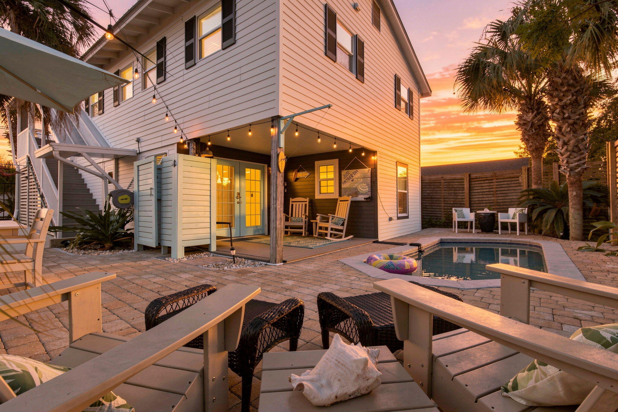 Welcome to Lil' Laguna -- a classic Florida beach cottage with coastal charm and a lot of personality! Just two blocks from the sugar-white sands and emerald waters of the Gulf, this charming home captures the easygoing spirit of old Florida beach life while offering the flexibility and amenities today's buyers and guests are looking for.

Located in the sought-after Laguna Beach area on the desirable west end of Panama City Beach, Lil' Laguna offers Gulf views from the front porch, living room, and kitchen, with the main living space thoughtfully positioned on the second floor. Here, two spacious bedrooms each feature their own full bath, while the open-concept kitchen and living area is filled with tons of natural light. Step outside to the large screened-in porch -- the perfect spot for slow mornings, afternoon naps, or gathering with friends after a day at the beach.

And then there's the pool! The private backyard is truly where the beach lifestyle shines through, with a sparkling pool that can easily be heated, outdoor fireplace, string lights, dining area, outdoor shower, and multiple spaces to relax and unwind. It's made for pool days, sunset cocktails, and evenings spent lingering with family and friends. The first floor adds even more versatility with its own private entrance, kitchen, living area, bedroom, full bath, and cozy bunk room. You also have a garage for storing beach gear, bikes and your golf cart. Use the home as one spacious residence, enjoy separate living spaces, or create a flexible rental setup -- the possibilities are endless. Short-term rental friendly, no HOA, and offered fully furnished with a fun boho-chic vibe, Lil' Laguna is ready to enjoy from day one.

The location puts you right in the heart of everything that makes this stretch of the Emerald Coast so special. The beach is just minutes away, while Carousel Supermarket, Thomas' Donuts, Carillon, Pier Park, Topgolf, restaurants, shopping, live music, and local entertainment are all close by. And when adventure calls, you're just a short drive from kayaking and paddleboarding, jet skiing, Shipwreck Island Waterpark, Shell Island, dolphin cruises, and the natural beauty of St. Andrews State Park. Plus, the charm and dining of 30A are only about eight minutes away.

Lil' Laguna is more than a beach house -- it's a little slice of classic Florida, where the days are sunny, the evenings are breezy, and life feels a little more relaxed. Come see this one-of-a-kind coastal cottage and experience the easy beach lifestyle for yourself! 

Buyer to verify all dimensions, fees & written information.