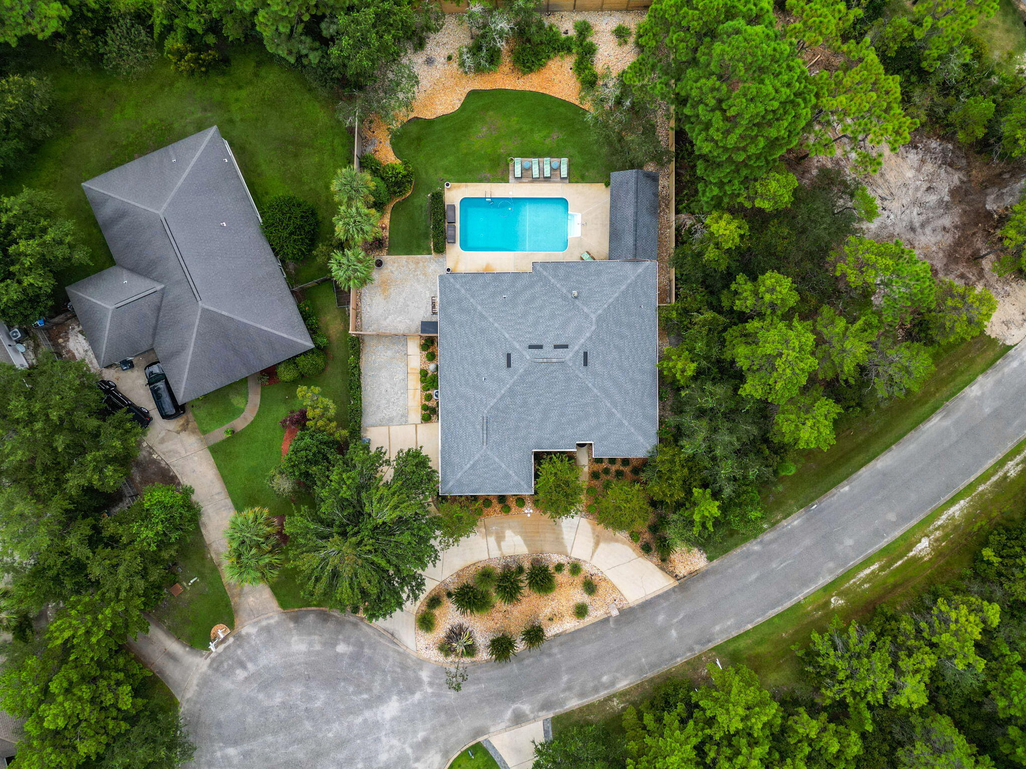 Nestled on a large, level cul-de-sac lot in the gated waterfront community of Pelican Bay, this beautifully updated brick ranch offers the perfect combination of comfort, privacy, and coastal living. Featuring 4 split bedroom one of which is currently used as home office, and 2.5 baths, the home is thoughtfully designed with spacious living areas and quality updates throughout. 

Interior Features include tile flooring throughout, quartz countertops, metallic metal back splash and abundant natural light enhanced by new hurricane impact windows and door glass installed in 2024. Major system updates provide peace of mind, including a roof replaced in 2021, HVAC in 2019, garage icemaker, additional attic insulation, Culligan Water treatment system, pool liner in 2021, pool pump 2022, and a new privacy fence added in 2025.

Step outside to your own private retreat with professionally landscaped grounds, a sparkling pool, and a pool cabana ideal for entertaining or relaxing year round.

Residents of Pelican Bay enjoy exclusive amenities including a bayfront park and tennis courts, all conveniently located close to the bay , shopping and waterfront recreation.