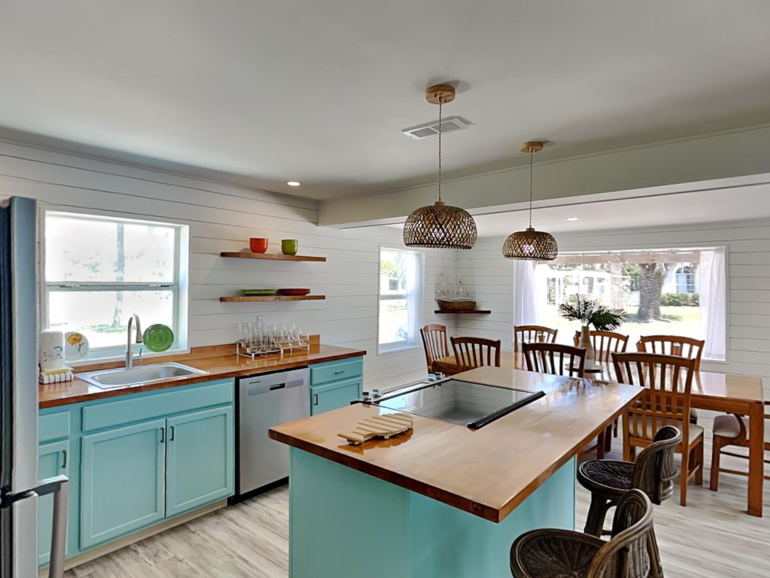 Take a look at this rare multi-use opportunity just steps from the sugar-white sands of Panama City Beach. Located less than a block from dedicated beach access, this renovated fully furnished coastal duplex offers the flexibility to be used as a private beach retreat, an income-producing investment, or the perfect blend of both.  Featuring 6 bedrooms, 4 bathrooms, and two beautifully updated kitchens, this spacious property comfortably accommodates up to 16 guests with room for everyone to relax after a day at the beach. Whether you're hosting family vacations, generating short-term rental income, or living in one side while renting the other, the possibilities here are endless. Relax and enjoy gulf glimpses, salt breezes, and a fantastic walkable location near shopping, restaurants, and entertainment all while being tucked away in a charming beachside setting. Offered fully furnished and turn-key, this property is ready to start making memories and income from day one. Properties with this combination of location, flexibility, and income potential rarely come available. Make your appointment today!