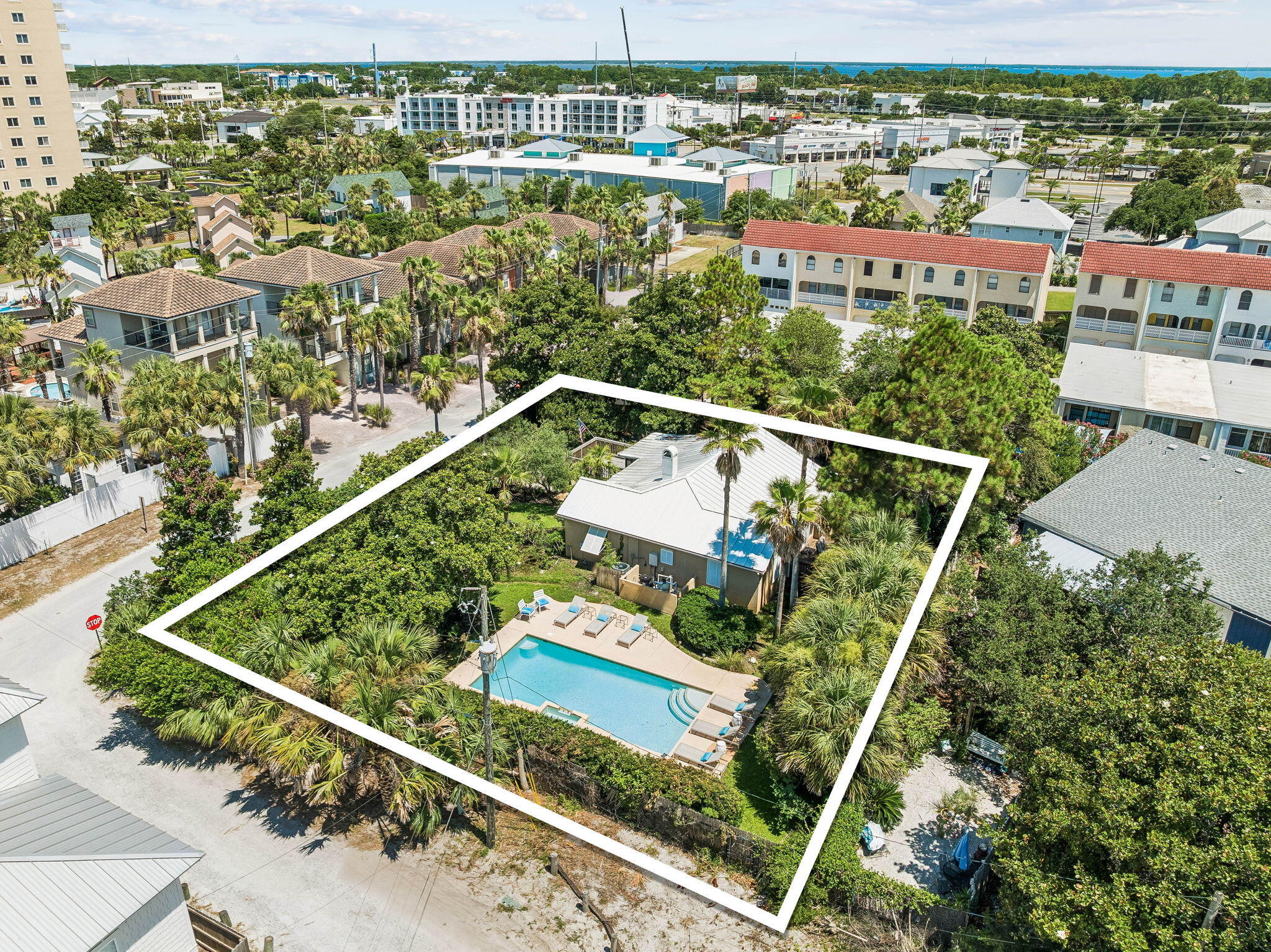 This premium, approximately 0.3-acre homesite sits just steps from the beach access directly across the street, offering exceptional redevelopment potential in the absolute heart of Miramar Beach. What truly sets this parcel apart is its distinct natural elevation. This unique topography provides excellent natural drainage, enhanced privacy, and potentially superior view corridors for your future build. The estate-sized footprint offers ample space to design a sprawling custom coastal estate, a high-performing investment property, or a private second-home oasis with room for a pool and extensive outdoor living areas. Additionally, the grounds are already framed by beautifully established landscaping, including mature palms and shade trees, providing an instant, high-end tropical foundation that would take years to cultivate from scratch. Please note that there is an existing, structurally sound home on the parcel. Buyers have the flexibility to use the existing structure, remodel, or clear the site entirely to make way for a brand new architectural masterpiece. All redevelopment plans, zoning, and building uses are subject to buyer verification. Do not miss this rare chance to secure an elevated beachside canvas in a premier location.