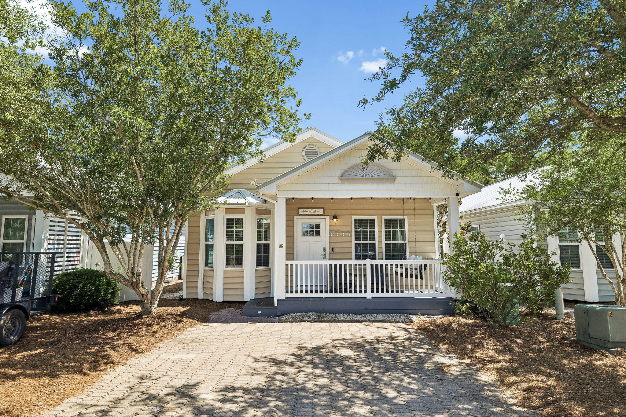 Finding a property in Seagrove Beach that offers walkability to the Gulf, room for family and guests, and an approachable price point has become increasingly difficult. This fully furnished 2-bedroom, 2-bath cottage presents an opportunity to own in one of 30A's most sought-after beach communities without stretching into seven-figure territory.

Located within Seagrove Beach Cottages, a private 16-home community centered around a community pool, the property combines a highly efficient floor plan with the lifestyle that continues to drive demand along 30A. At 956 square feet, the layout makes exceptional use of the space, featuring two private bedrooms, two full bathrooms, and accommodations for up to seven guests. The open-concept living, dining, and kitchen areas serve as the main gathering place, while the bedroom layout provides privacy and flexibility for owners, family members, and visiting guests.

Additional features include two dedicated parking spaces, an EV charger, in-unit laundry, and a private backyard with room for future enhancements. Whether adding outdoor seating, recreation space, or additional landscaping, the backyard offers an opportunity to further personalize the property while enhancing guest appeal.

The community consists of just 16 cottages creating a neighborhood atmosphere that feels increasingly rare along 30A. The pool, outdoor dining areas, grills, and gathering spaces are all located just steps from the front porch, creating an easy extension of the home's outdoor living space.

From here, owners and guests can walk or bike to the beach, nearby restaurants, and local favorites throughout Seagrove Beach. The ability to leave the car parked and enjoy the area by foot or bike is one of the reasons properties in this location continue to attract both second-home owners and vacation renters.