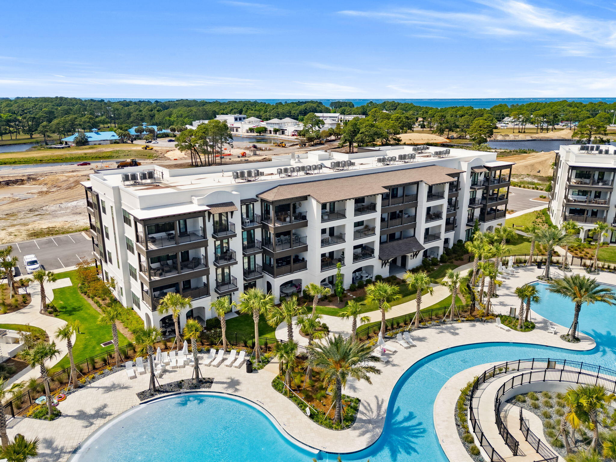 Exclusive opportunity to own one of the 5 remaining new units at The Grove at Seascape. Unparalleled amenities, design and interior finishes all within the guard gated Seascape community. Situated in the lively amenity area viewing pools, this unit features 9 FT ceilings throughout, high end quartz countertops, Bosch appliances with gas cooking, a spacious island for entertaining and a work desk space. Split bedroom plan with 2 full baths plus a private bunk room and walk in laundry room. The primary bedroom features doors onto the covered balcony. The community overlooks the Aquatic Garden amenities featuring lush landscaped grounds, multiple pools including a relaxing lazy river, zero entry pool with exclusive use by the Grove owners and guests. Included by developer in the purchase is a 12 month lease for a storage closet situated on the ground floor.