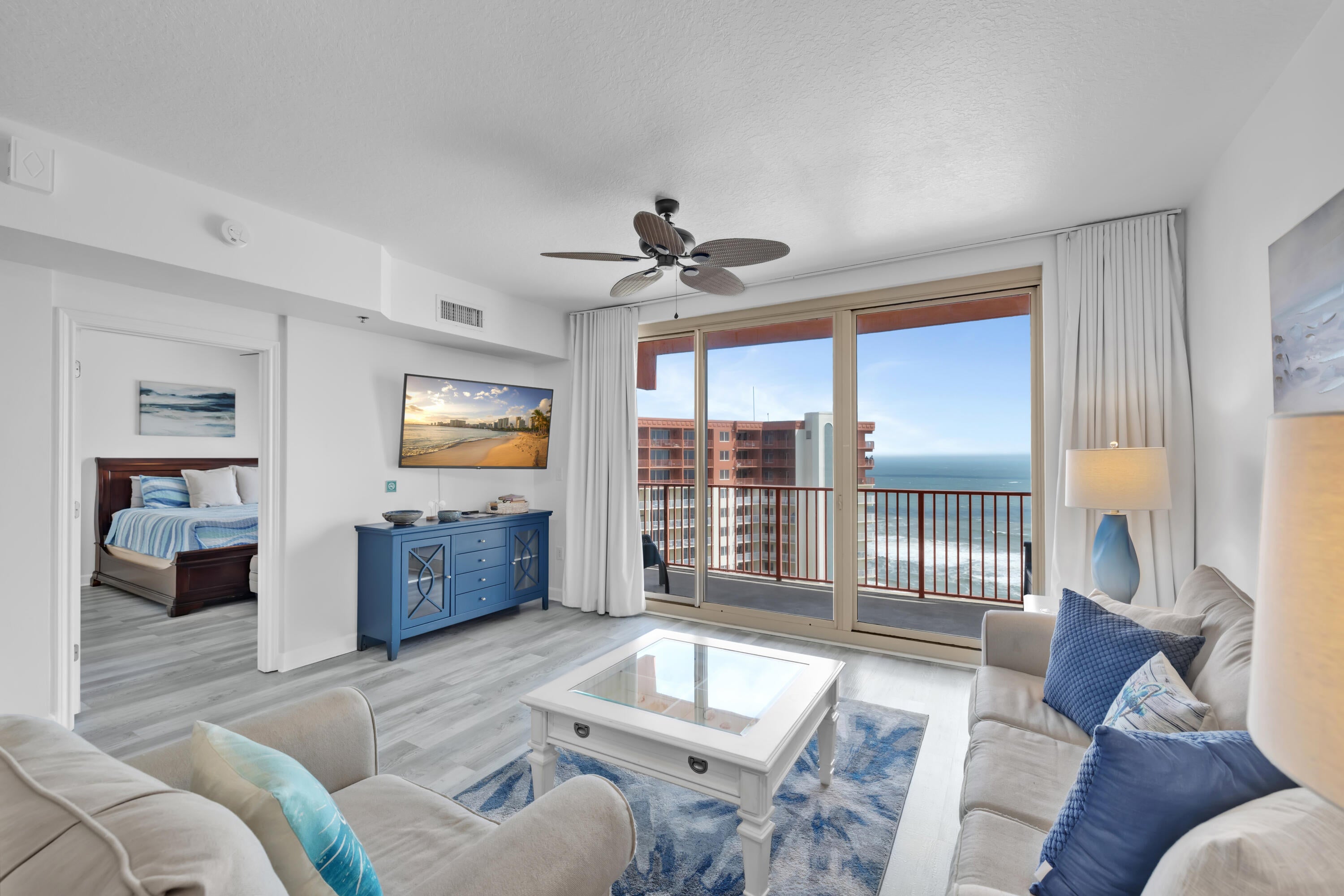 HIGH FLOOR. GULF-FRONT PRIMARY SUITE. 30-FOOT BALCONY. Shores of Panama 2213 is a furnished Type C floor plan on the 22nd floor of Shores of Panama Resort in Panama City Beach, Florida, featuring one bedroom, a private bunk room, two full bathrooms, and accommodations for up to six guests. The Gulf-front primary suite includes a king-size bed, Gulf views, a private ensuite bathroom, and a renovated vanity with a granite countertop, updated mirror, and updated lighting. A barn door provides separation and privacy for the bunk room, while the adjacent full bathroom includes a stackable washer and dryer and a dehumidifier.
The interior features luxury vinyl plank flooring throughout, coastal-inspired décor, updated light fixtures, flat-screen televisions, granite kitchen countertops, and abundant natural light. The oversized balcony extends more than 30 feet across the unit, providing elevated views of the Gulf, the resort's lagoon-style pool, and the surrounding coastline.
The property generated $36,171 in gross rental income during 2025. Gross rental income for 2026 totaled $24,330 through June, excluding July, with the current pace positioned to meet or exceed the prior year despite owner use. Rental figures are provided for reference only and are not a guarantee of future performance. The HVAC system was installed in 2017, and the water heater was installed in 2018.
This unit does not include a deeded parking space. Overflow parking is available throughout the resort parking , subject to resort rules and availability.
Shores of Panama Resort features a large Gulf-front lagoon-style pool with zero-entry access, palm-lined islands, fountains, and a spacious hot tub. Additional amenities include resort-exclusive beachfront access, an indoor heated pool and hot tub, a 24-hour fitness center, a seasonal poolside Tiki bar, covered parking, complimentary Wi-Fi, and on-site security. Pineapple Willy's is adjacent to the resort, while Laketown Wharf across the street offers dining, retail, and entertainment options. Additional Panama City Beach attractions include Pirates Voyage Dinner & Show, Topgolf, McGuire's Irish Pub, and Tootsie's Orchid Lounge.
Quarterly HOA dues are currently $3,491.71. All information, measurements, rental figures, availability, and HOA fees are deemed reliable but not guaranteed; buyer to verify if important.