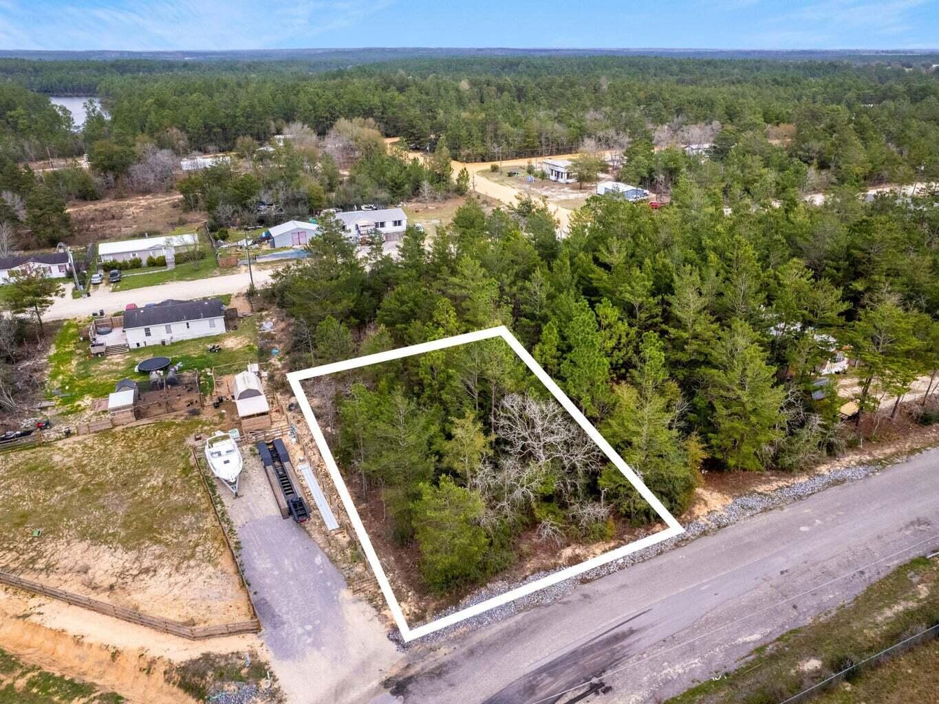 This vacant lot in the Oakwood Hills neighborhood is smartly priced and well-located with easy access to U.S. Highway 90 and I-10. Build your home in a quiet neighborhood with no build-out time or HOA fees. DeFuniak Springs offers a relaxed setting with convenient access to everyday essentials, local dining, shopping, schools, parks and healthcare services. Its location along the Interstate 10 corridor provides straightforward connections throughout northwest Florida, while the sugar-white sand beaches of Scenic Highway 30A are approximately 30 to 40 miles south, making a day along the Gulf of America an easy option. Residents can enjoy the charm and slower pace of an inland community while remaining within a comfortable driving distance of 30A, Miramar Beach, and the dining, shopping, and recreation found throughout the Emerald Coast.
