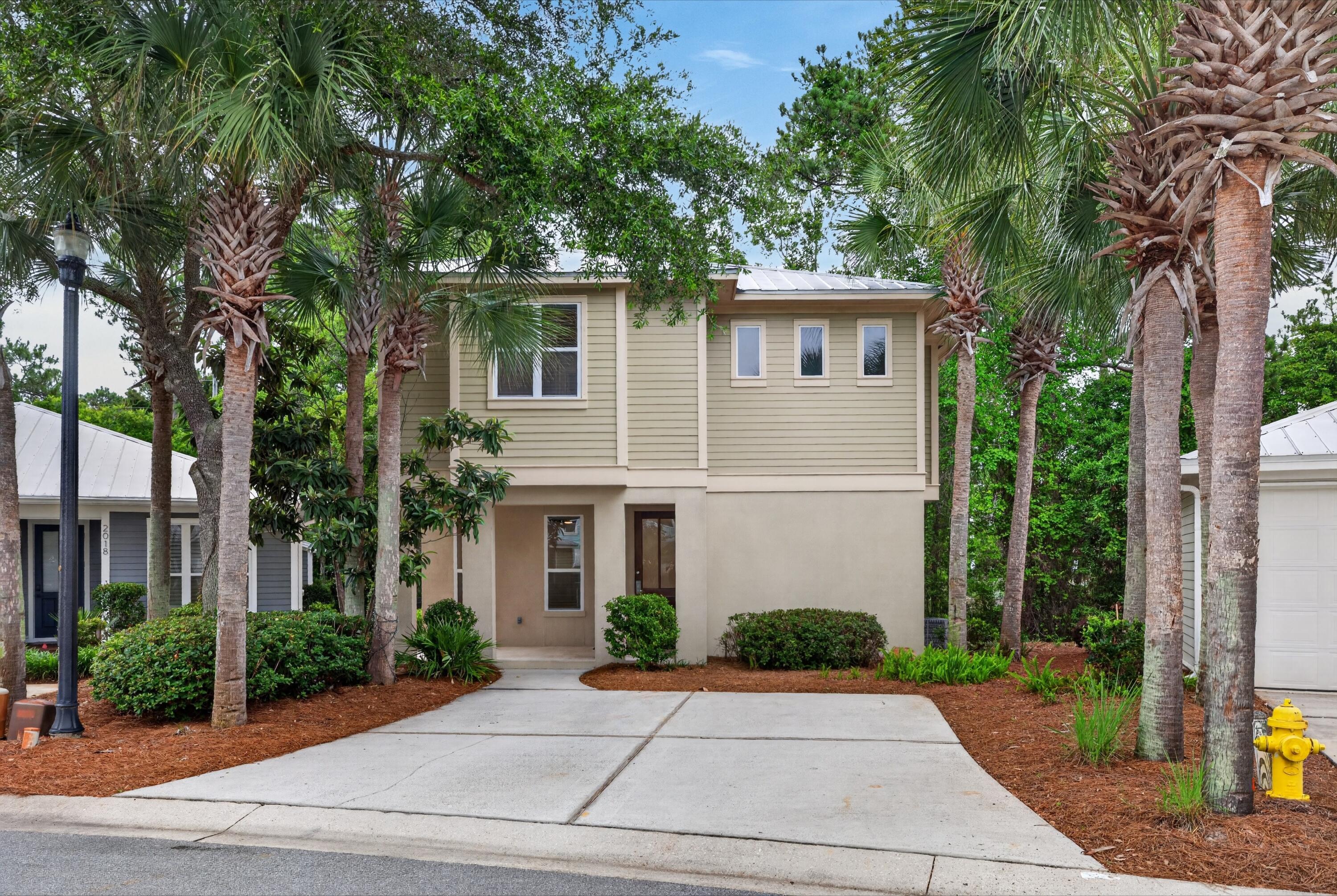 UNFURNISHED BEACH COTTAGE located in the Crystal Lake Community inside the Sandestin Golf & Beach Resort. Two-story home features an open floor plan with a spacious, open living area, and kitchen with breakfast bar, stainless appliances, and wooded views from windows and doors. Double doors in living area open to large deck - perfect for relaxing and entertaining. There is a guest bath and laundry room located on the first floor.  Upstairs, the main ensuite features large bath with walk-in glass shower, soaking tub, double vanities and TWO large walk-in closets. Two additional guest rooms share a full guest bath. First floor features tile flooring and luxury vinyl plank flooring throughout the second floor (with tile in the Master bath). All exterior landscaping, pest control, basic cable & internet, and trash removal covered by the Associations. Enjoy the short walk to the private Crystal Lake Pool, and enjoy all the amenities of the Resort Lifestyle.