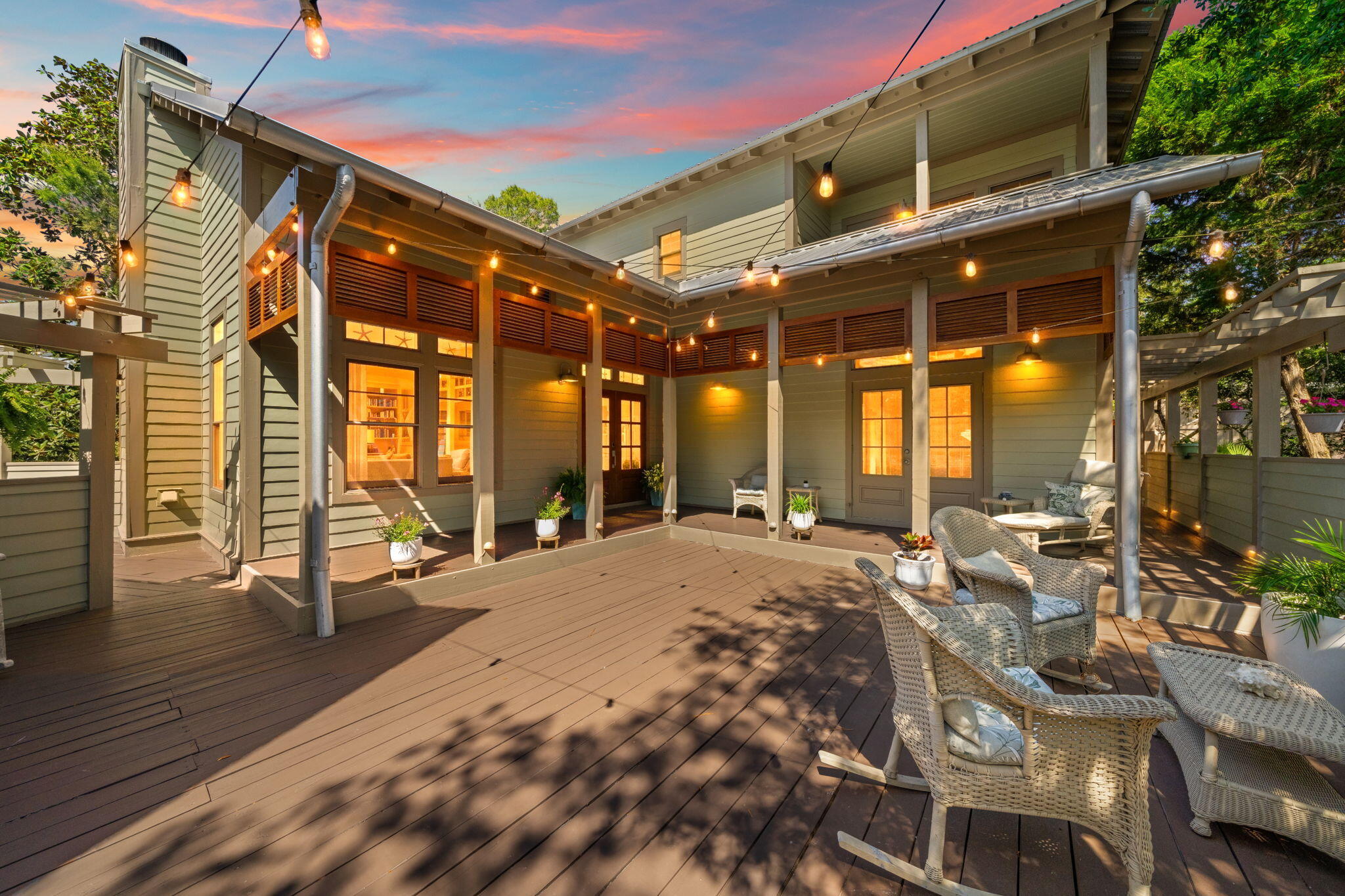 PROMINENT PRICE CHANGE ON 30A:

Welcome to your dream seaside sanctuary in the serene, gated enclave of Summer Ridge--just a half-mile from the beach and a short-term rental restricted neighborhood. 

This beautifully renovated home blends luxury and privacy, perfect for a primary or secondary resident and for those seeking the ultimate coastal lifestyle. Multiple outdoor spaces are bathed in oaks situated in a peaceful fully fenced yard.
  
 Enter through a gated outdoor enclave with multiple decks and a carriage space above the garage. Surrounded by lush greenery, the setting evokes a sense of seclusion offering a private, tranquil retreat. Offering an outdoor shower ideal for an apres beach outing.

As you pass through the elegant french doors discover a sunlit interior, complete with vaulted wood-beamed ceilings and expansive windows. Newly refinished hardwood floors extend throughout the open-concept layout, with the great room serving as a cozy centerpiece featuring a stunning fireplace adorned with Quartz Torino Gold.
 The modern kitchen is a culinary dream, equipped with Stainless Steel GE Café luxury appliances, including a six-burner gas stovetop. With Quartz Torino Gold countertops and a versatile breakfast bar,  perfect for entertaining. Enjoy dining in a beautiful dedicated space that invites warmth and camaraderie.
Conveniently located on the main level, the primary suite offers a private outdoor sitting area and an ensuite bath that boasts a sleek soaking tub, elegant glass shower, white subway tiles, and chic marble penny tile flooring. 

 The first level also features a spacious laundry suite and additional storage, plus a conveniently located powder room near the outdoor area. Leading to additional outdoor entertaining or media space enclosed in a screened in porch overlooking the deciduous scrub oaks and natural fence.

 Ascend the floating stairs to reveal a thoughtfully designed split floor plan, featuring two generous guest bedrooms. One guest room boasts its own private balcony, while the two rooms share a stylish Jack & Jill bath, adorned with moon rock double vanities and custom niches in the seamlessly tiled shower.

Perfectly Located for Coastal Living: This home is just 0.70 miles from the pristine beaches and the shimmering Gulf of Mexico. Enjoy easy access to shopping, dining, and entertainment at Gulf Place, which features a vibrant farmer's market and a bustling amphitheater hosting summer concerts and events. The Santa Rosa Beach and Golf Club is a mere 10-minute golf cart ride away.