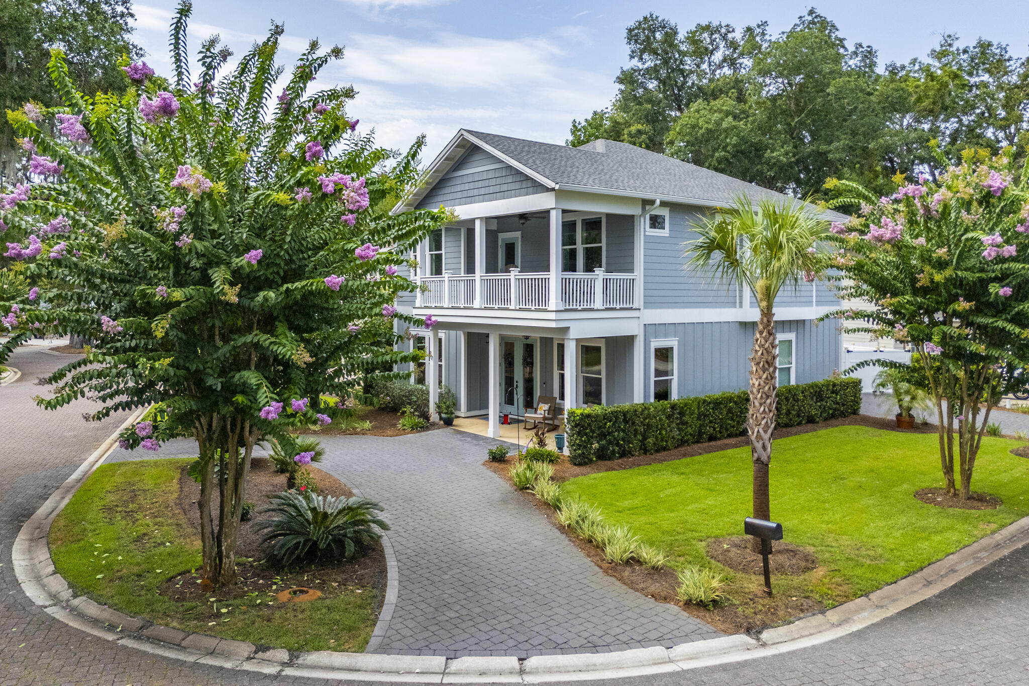 Experience luxury coastal living in the peaceful, non-rental waterfront community of Sacred Oaks in Santa Rosa Beach. Built in 2021, this custom 4-bedroom Craftsman home sits on a desirable corner lot just 200 feet from the community dock and park, offering easy access to the bayou and Choctawhatchee Bay for boating, fishing, kayaking, and paddleboarding. Lined with majestic oaks and charming paver streets, Sacred Oaks provides a serene setting just minutes from Grand Boulevard, Sandestin Golf and Beach Resort, and Topsail Hill Preserve State Park.
Designed for full-time living, the home features abundant storage, an oversized garage, dual paver driveways, and gated boat parking. The inviting board-and-batten exterior and welcoming front porch complement the bright, open-concept floor plan with luxury vinyl plank flooring, Quartz countertops, stainless steel appliances, a gas range, custom tile backsplash, and spacious living and dining areas. The first floor also includes a guest suite with ensuite bath, powder room & large laundry room. Upstairs, the primary suite offers 10-foot ceilings, a shiplap accent wall, barn doors, and a spa-inspired bath with a soaking tub, dual-head tiled shower, and Quartz double vanity. Two additional bedrooms, a guest bath, wet bar with wine refrigerator, and a spacious balcony overlooking the bayou and oak trees complete the second level. Built with quality & efficiency, the 2x6 construction and storm-rated windows will put your mind at ease! Additional features include enhanced exterior insulation, sound-insulated interior walls, raised ceilings, remote-controlled window treatments, high-end lighting and ceiling fans, an irrigation well, concrete slab foundation, tankless water heater, gutters with LeafGuard protection, an outdoor shower, and a gas stub for a future summer kitchen or fire pit. Offering the perfect balance of privacy, quality craftsmanship, and waterfront recreation, this exceptional home in a non short-term rental community is a rare opportunity to enjoy the best of the Emerald Coast lifestyle.