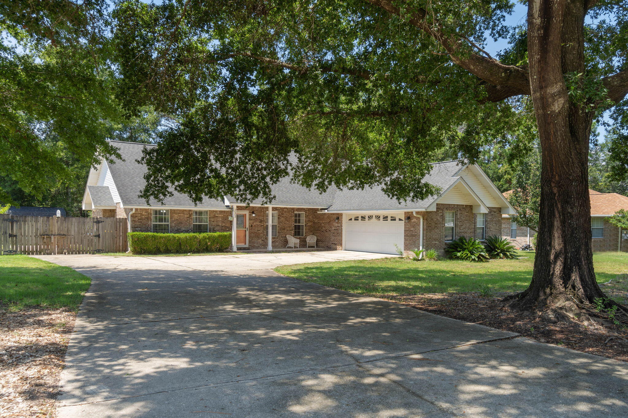 Welcome to Rocky Bayou Estates! This 3-bedroom, 2.5-bathroom home offers space, style, and comfort on a nearly half-acre lot in one of the area's most desirable neighborhoods. As you arrive, the charming curb appeal, complete with meticulous landscaping and a cozy front porch, sets the tone for this inviting home. Step inside, and you are welcomed by a bright entryway, leading into a spacious open-concept living area. The Great Room is the heart of the home, featuring a soaring cathedral ceiling, tile flooring, custom built-in cabinetry, and a gas fireplace, perfect for cozy evenings. French doors provide access to the screened porch, where you can enjoy outdoor living in style, complete with a ceiling fan to keep cool. For the home chef, the updated kitchen is a dream, offering beautiful cabinetry, granite countertops, and a breakfast bar that overlooks the family room, making it easy to entertain while preparing meals. The kitchen flows seamlessly into a sunlit dining area, perfect for family gatherings. The master suite is a true retreat, featuring a sitting area with a tray ceiling, and a luxurious en-suite bathroom with a separate tiled shower, garden tub, double vanities, and a large walk-in closet. The two additional bedrooms are generously sized, sharing a Jack & Jill bathroom with plenty of closet and storage space. Step outside to your fully fenced backyard, a true oasis with ample space for kids to play or for hosting gatherings. The patio area is ideal for barbecues, and there's even a dedicated boat/RV slab for your recreational needs. Additional features include a spacious laundry room, an attached two-car garage, and beautiful outdoor views from almost every room. Step into your new life at Rocky Bayou Estates, where every detail has been thoughtfully crafted to offer you comfort, convenience, and style. Whether you're relaxing by the fireplace, hosting gatherings in your gourmet kitchen, or enjoying a quiet evening on the screened porch, this home is designed to elevate your everyday living. With its prime location, generous lot, and modern amenities, this property is not just a house, it's the place where you'll create lasting memories. Don't miss the opportunity to make this exceptional home yours! Roof- 2011. Water Heater- 2018. HVAC- 2012.