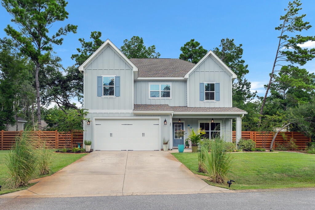 **SELLER OFFERING UP TO $5,000 TOWARDS BUYER CLOSING COSTS, RATE BUYDOWN, HOME WARRANTY AND/OR PREPAIDS**

Welcome to 37 J Hunter's Way N in the gated community of Magnolia Bay Estates. Built in 2024 and thoughtfully upgraded throughout, this 5-bedroom, 4-bath home offers the benefits of new construction with thoughtful finishes. 

The heart of the home is a stunning kitchen with white cabinetry, a navy island, quartz countertops, stainless steel appliances, a gas range with vent hood, and an oversized walk-in pantry. Lighting complements the kitchen and dining areas, while luxury vinyl plank flooring extends throughout the main living spaces, first-floor bedroom/office, and owner's suite.

A spacious owner's suite features dual vanities, a soaking tub, a tiled walk-in shower, and a large walk-in closet. The upstairs loft is ideal as a media room, playroom, home office, or gym. Upgraded ceiling fans, 5.5-inch open-cell spray foam insulation, and Emerald Coast Glass Products Slate Series window tint enhance comfort, privacy, and efficiency.

Outside, professionally designed landscaping with colorful flower beds, ornamental grasses, shrubs, herbs, and fruit trees is enhanced by irrigation, decorative stone edging, and solar lighting. A premium horizontal cedar shadow-box fence, professionally stained in a Sherwin-Williams cedar finish, creates a private backyard retreat, while gutters with gutter guards add convenience.

Every detail thoughtfully upgraded... move in and enjo