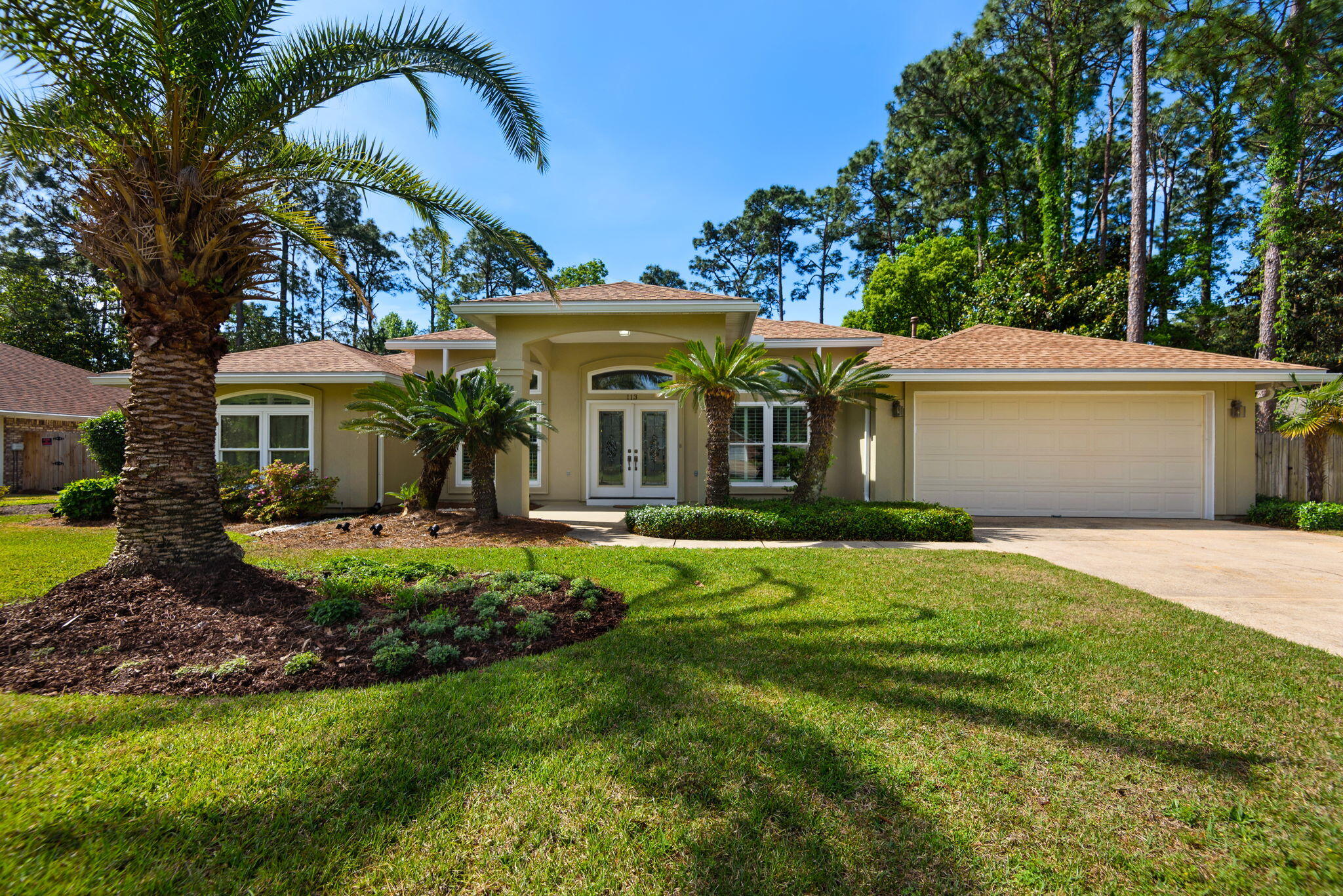 This beautifully maintained Dana Pointe home offers comfort, character, and an exceptional layout with 3 bedrooms plus an office that could serve as a 4th bedroom. Inside, you'll find soaring 13-foot ceilings, recessed lighting, crown molding, formal living and dining rooms, and a spacious great room with gas fireplace, built-in entertainment center, and shelving. The kitchen is designed for efficiency with a built-in oven, solid surface cooktop, large pantry, abundant counter space, and breakfast nook overlooking the Florida room and beautifully landscaped backyard. The split floorplan provides privacy, with the primary suite featuring private access to the Florida room, dual vanities, whirlpool tub, separate shower, neutral tile, and a custom walk-in closet. The office includes built-in oak cabinets, desk, full bath, and French doors leading to the pool area. Outside, enjoy the heated screened pool, fish pond, sago palms, privacy fencing, and epoxy-coated patio and garage. Major updates include roof 2020, windows and pool screen in 2025. Dana Pointe is a private bayfront community with deeded bay access, private park, boat ramp, dock, gazebo/pavilion, and HOA amenities. Showings begin May 18.