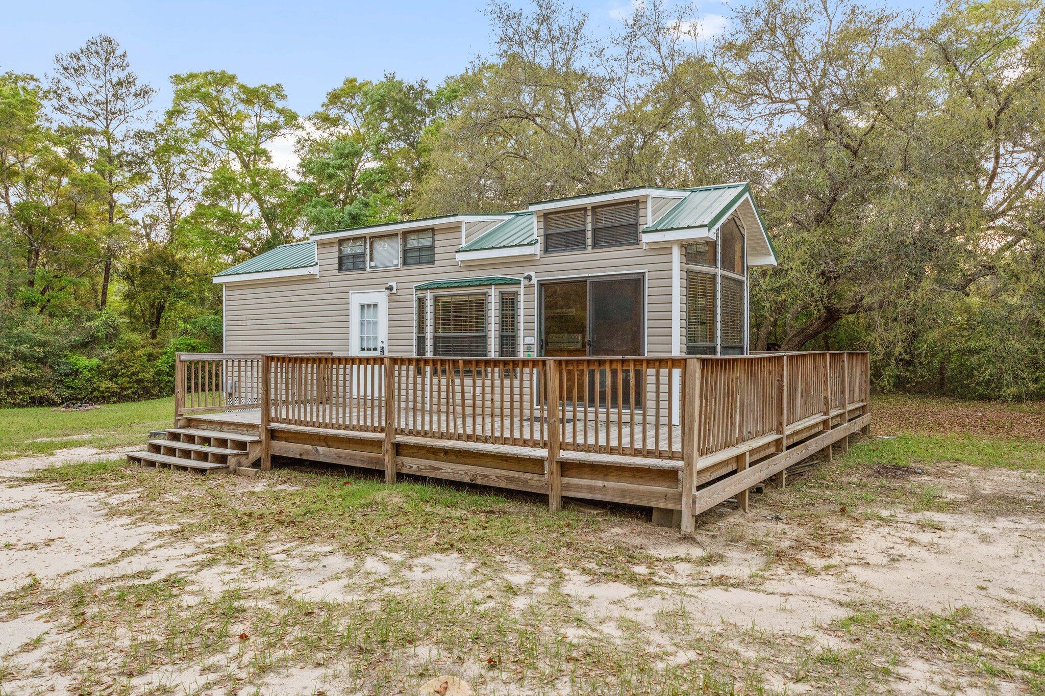 Charming 1BR/1BA home for rent in Freeport, FL! Enjoy the best of tiny living on a spacious 2-acre lot with tons of outdoor living space—perfect for relaxing, gardening, or enjoying nature. Inside, you'll find a bright and airy layout with a well-equipped kitchen and cozy bedroom, ideal for individuals or couples seeking simplicity and comfort. Tucked away in a peaceful neighborhood, yet conveniently close to shops, dining, and outdoor recreation. Just a short drive to the beautiful beaches of South Walton and Destin. If you've been dreaming of a quiet retreat with big charm and plenty of space to breathe, this one's for you. Don't miss out—schedule a showing today!