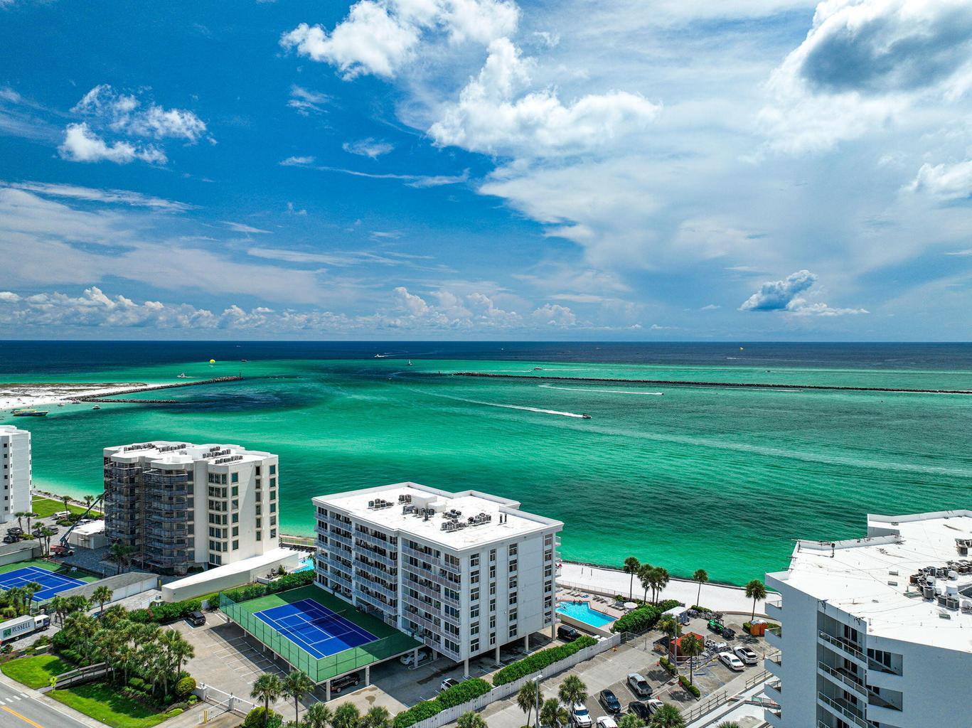 Boat Slip Included!  Experience breathtaking panoramic views of the Destin Harbor from every room in this beautifully appointed condo. Fully furnished and move-in ready featuring a stylish, chic interior complete with stainless steel appliances.  Abundant natural light fills the space, creating a warm and inviting atmosphere perfect for both relaxation and entertaining.  
A private 38' boat slip is included, (slip 7), which is located across the street.  Marina HOA fees are only $75 per month.  
Rental Projection (condo only) is up to $86,450.  Boat Slip rental fees up to $150 per night.  See in Documents.

Residents of Waterview Towers enjoy exclusive access to a private beach along with premium amenities, including a beachfront pool and hot tub with views of Crab Island and the Destin Pass. Enjoy tennis and pickleball courts, a fitness center and an upcoming new grill area.  
 Come enjoy coastal living at its finest