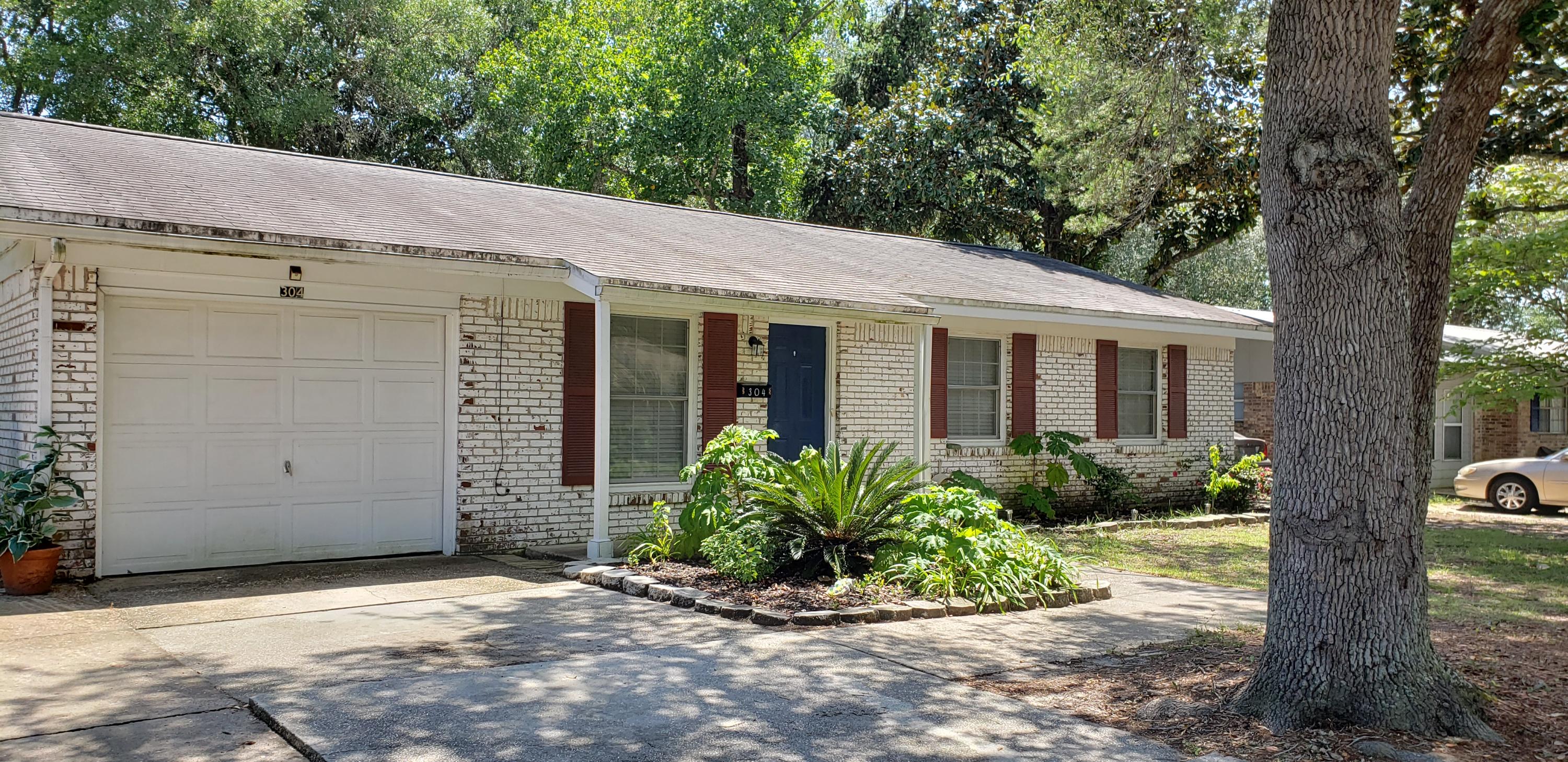 Great 3 bedroom, 2 bath home that still has a 1 car attached garage! The living room is open to the large eat-in kitchen. Step out back and enjoy the back patio and the huge back yard! No carpeting at all! Tile and faux wood throughout! Pets are allowed with restrictions.