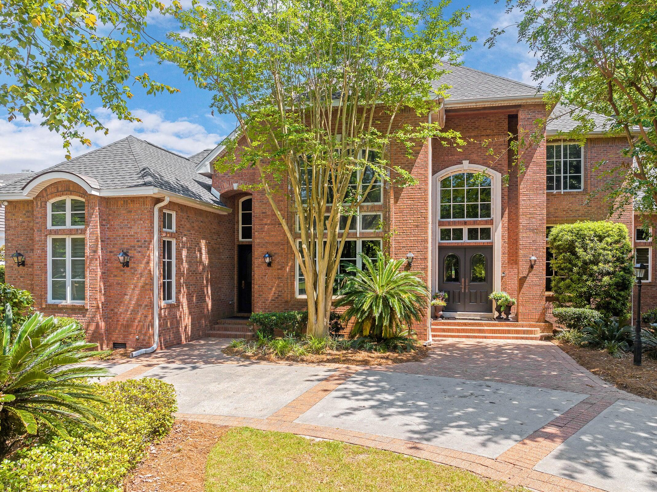 Stunning Custom Estate in Prestigious Kelly Plantation - Gated Golf & Lakefront Living Nestled into lush foliage adjacent to the 8th hole of the Kelly Plantation golf course and backing up to a serene lake, this exceptional 6,020 sq ft custom-built home offers tranquil resort-style living in one of Destin's most sought-after gated communities. Built in 2001 with outstanding architecture and meticulous attention to detail, this 4-bedroom, 5 full + 1 half bath residence welcomes you through grand double mahogany doors into a dramatic 27-foot ceiling foyer. An elegant wooden arched staircase with wrought-iron balustrade leads upstairs, setting the tone for the home's timeless elegance. Highlights include: Walnut-paneled two-story study with a hidden ''secret room,'' extensive built-in bookcases and bonus office space. Gourmet kitchen designed for serious entertaining, featuring high-end Viking, Bosch, Sub-Zero, and Fisher & Paykel appliances, a striking brick-surrounded double oven and hood, the large pantry with authentic 1700s French doors and hardware, multiple sinks, icemakers, dishwashers, and more. Four spacious bedroom suites -- each with coffered ceilings, large walk-in closets, and private ensuite baths (primary bath boasts a spa tub, heated porcelain floors, and a multi-head shower). First-floor mother-in-law suite with private entrance and kitchenette. Oversized upstairs media room with blackout drapes. Six indoor fireplaces plus one outdoor, plus four HVAC units for year-round comfort. Additional first-floor office, multi-use beverage center with copper sink, powder room, and laundry. Step outside to your private oasis: a screened terrace overlooking the lake and golf course, a refreshing 30x14 salt water pool with pool cabana, and multiple open terraces and covered porches ideal for al fresco dining and relaxing. The 3-car garage features hurricane-proof doors, and a full security camera system provides peace of mind. Kelly Plantation offers golf, tennis, pickleball, multiple pools, a remodeled Owners Club, and more. Just minutes from world-class Destin beaches, dining, shopping, and entertainment. Conveniently located near Destin Middle and High Schools. This one-of-a-kind estate combines luxury, privacy, and functionality on a beautifully landscaped ~0.52-acre lot. A rare opportunity in the heart of Destin.