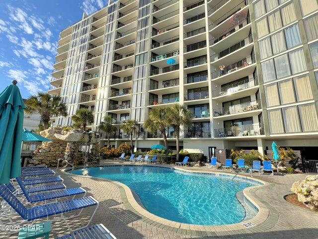 Incredible glass-front unit! Experience the ultimate coastal lifestyle in this beautiful two-bedroom, gulf-front condo perched on the 11th floor of Tower 2 at the iconic Edgewater Beach & Golf Resort. Step onto your private balcony and soak in panoramic views of sugar-white sands and emerald waters--your daily invitation to paradise. Inside, spacious rooms are filled with beachy colors, tile flooring, paneled doors, and NEW floor-to-ceiling sliding glass doors in BOTH the living and dining areas. The AC and water heater were replaced in 2020. The unit comes fully furnished and turnkey, ready for short-term rental or your own beach retreat. Edgewater is Panama City Beach's largest full-service resort, spanning 110 acres of prime Gulf-front property. Residents and guests enjoy access to 11  sparkling pools (10 heated seasonally), a grand lagoon pool, multiple hot tubs, and exclusive beachfront amenities. Tower 2 features its own heated pool, hot tub, and sun decks, just steps from the main beachfront amenities. Onsite dining includes Ocean's Bar & Grill and Edgie's Market with Starbucks and ice cream. The community offers 24-hour gated security, convenient parking--including vehicle charging and spaces for RVs, boats, and jet skis--and is pet-friendly for owners. The dog beach and park are just minutes away. There is a par-3 executive golf course, pickleball courts, fitness center, shuffleboard, basketball, and Plexicushion tennis courts. Edgewater's lively social calendar features seasonal activities, family events, and live entertainment. The Shoppes across the street provides shopping, dining, and entertainment options. Whether you seek a personal family retreat, an active second home, or a rental investment property, this condo delivers the beach lifestyle you've dreamed of--where luxury meets leisure in a vibrant coastal community.