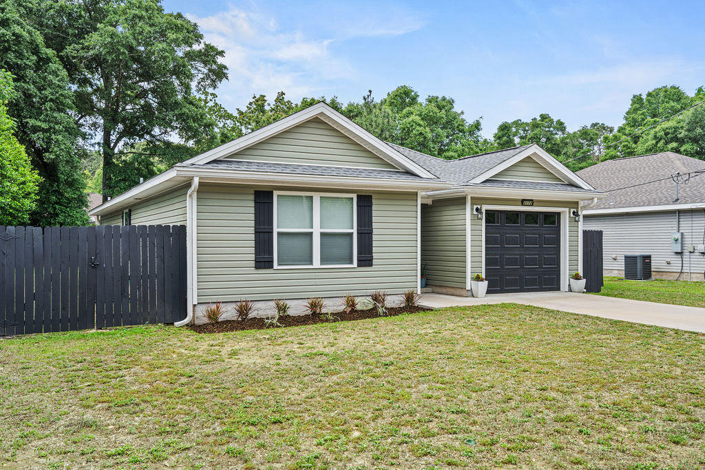 Better than new! Why buy new construction and spend thousands more on upgrades when you can move right into a one-owner, like-new home that's already complete? Built in 2022 by a respected local builder, this beautifully maintained one-owner home offers everything buyers love about newer construction - PLUS all the upgrades that aren't included with many new builds. Enjoy a privacy-fenced backyard, gutters, storage building, extended patio, established landscaping, window treatments, refrigerator, washer & dryer and a spacious lot that's ready to enjoy from day one! All this and NO HOA! Inside, you'll find a bright open-concept floor plan with luxury vinyl plank flooring throughout the main living areas, dark shaker-style cabinetry, stainless appliances, and a split-bedroom layout designed for comfortable everyday living. The neutral finishes and meticulous care make this home truly move-in ready. Step outside to a covered back porch overlooking the large fenced backyard with mature trees providing privacy that's hard to find in many newer neighborhoods. To make the move even easier, the seller is offering $7,500 toward the buyer's closing cost - a tremendous value for today's buyers. Skip the construction delays, skip the upgrade expenses, and move into a home that's already finished.