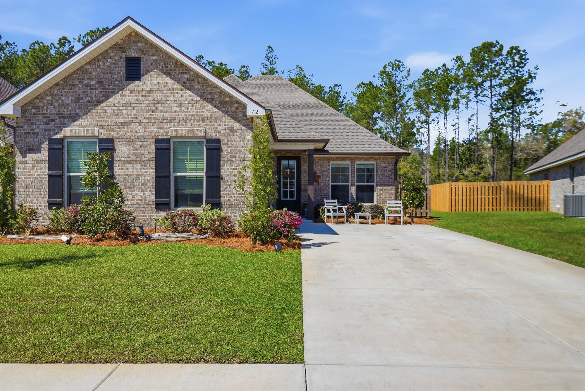 Move-In Ready - No Build Time Required! Welcome to the popular Manet II floor plan in the sought-after Creekside section of the master-planned community of Hammock Bay. Situated on a peaceful preserve lot with beautiful magnolia trees and mature hardwoods, this picture-perfect brick cottage offers privacy, style, and exceptional value.

Featuring 3 bedrooms, 2 bathrooms, and 2,041 square feet, this home boasts one of the largest living room layouts offered in the community. The current owners have invested nearly $18,000 in documented upgrades, making this home truly turnkey. Inside, you'll find ceramic wood-look tile flooring throughout--no carpet, elegant quartz countertops, stainless steel appliances, upgraded lighting, and additional electrical enhancements for added convenience and functionality. The spacious primary living areas are ideal for both everyday living and entertaining.

The exterior is equally impressive with gutters, enhanced outdoor lighting, additional exterior outlets, a side-entry garage, and pull-down attic access for extra storage. The generous backyard provides plenty of room to add a swimming pool or create the outdoor living space of your dreams.

As a resident of Hammock Bay, you'll enjoy access to outstanding community amenities, including walking trails, parks, green spaces, recreational facilities, and community gathering areas. Conveniently located near shopping, dining, outdoor recreation, Choctawhatchee Bay, and the sugar-white beaches of South Walton, this home offers the perfect combination of comfort, convenience, and coastal living.

Schedule your private showing today!