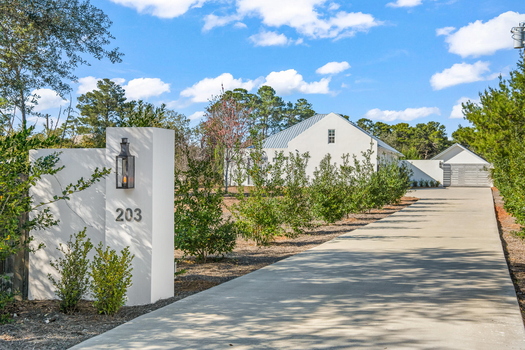 Presenting a rare and exclusive look at this highly customized 2023-built home in Inlet Beach that is set at an approximate elevation of 28 feet on a quiet 0.48 acre. The 1,812 square foot residence was thoughtfully constructed with precision engineering to meet the demands of ''off-grid'' living, including but not limited to concrete construction, deep well, advanced water filtration system, and solar capabilities. This expansive property offers 4 garage spaces and an RV hook-up with enough room for a tour bus, RV and boat, so bring all your recreational toys.  With only one owner and no HOA, this non-rental home has been meticulously maintained to meet the needs of the most sophisticated clientele.  Adjacent parcel may be available for purchase as well to add more privacy buffer to this property.