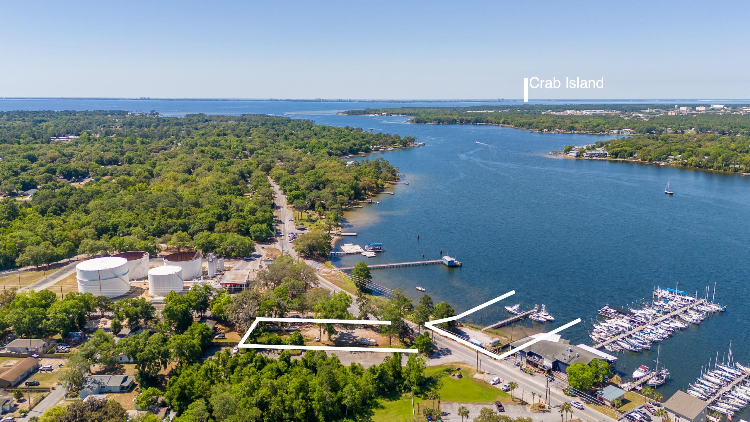 This is an excellent opportunity to own one of the last waterfront parcels featuring a 10-slip marina 75 ft on Boggy Bayou, located next to the Wharf 850 in Niceville, Florida. The property consists of 0.58 acres with commercial zoning, offering a variety of possibilities includes parking lot (buyers to verify marina expansion options). 

It's just a short 20-minute boat ride to the Destin Pass. The boat slips range in size from 14 to 16 feet wide with a depth of 4 to 5 feet, up to 18 feet wide with a depth of 8 to 10 feet. The last four slips can accommodate 50-foot sport fishing boats, and the end of the dock is approximately 10 feet deep.