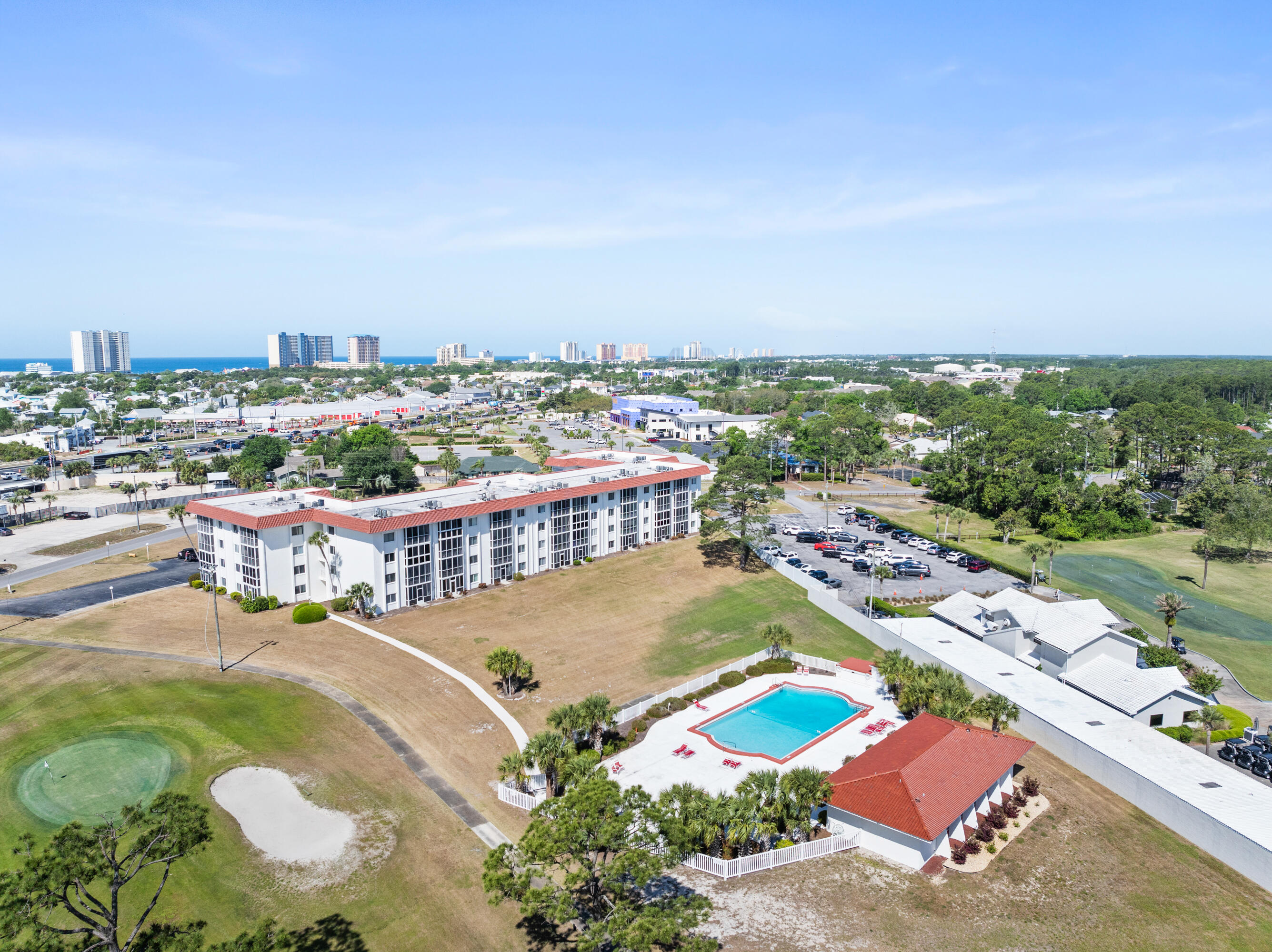 These views are spectacular! Sit on the back patio with a beverage and overlook the gorgeous pool (newly resurfaced the decking and updated the bathrooms).  The golf course views are amazing as well.  Walk over to the driving range and work on your game.  This 2BR/1BA has been well maintained and is being sold furnished.  It is just waiting on you to make it your primary or vacation home.  Great investment as well, as you are just minutes from Pier Park shopping, restaurants and the Gulf of Mexico.  Come see it, as this one won't last long!