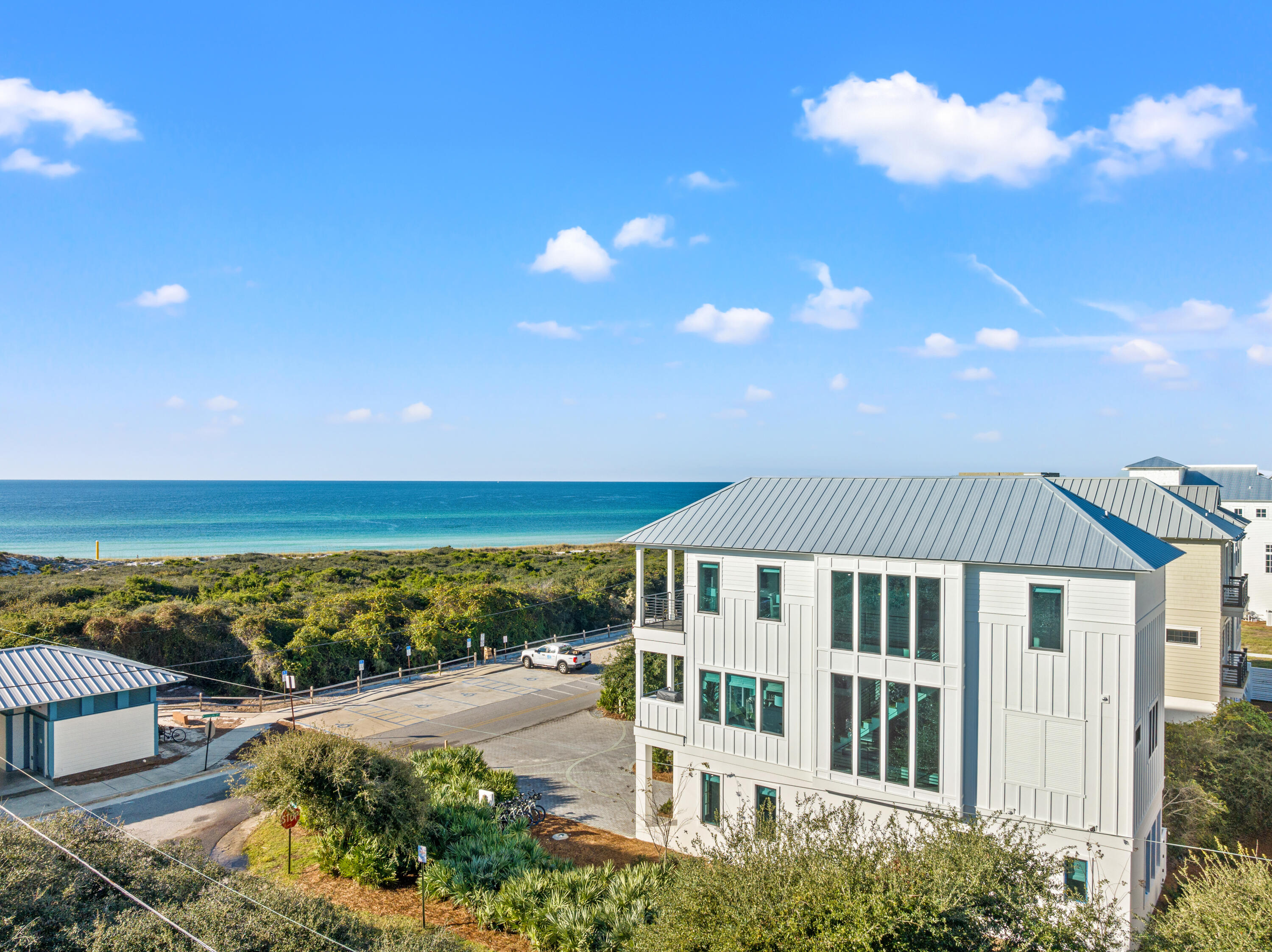 Welcome to 306 W Park Place Avenue, where contemporary luxury meets the best of beach living. This brand-new, professionally designed home is fully furnished with impeccable style, offering breathtaking Gulf views from nearly every room--a rare feature that ensures your view will remain pristine. With 5 bedrooms and 5.5 bathrooms, this property seamlessly blends modern convenience with coastal charm.

Located just steps from the beach boardwalk, you can easily access the stunning shoreline, putting you just moments away from the sand and surf.

The main living area is located on the second floor, where an expansive, open-concept layout invites natural light to flood the space. The spacious living room flows effortlessly into the chef's kitchen, designed for both functionality and elegance, featuring high-end appliances, custom cabinetry, and a large central island perfect for preparing meals or gathering with friends. Perfect for entertaining, the living area opens up to an expansive balcony with a summer kitchen and built-in grill. Imagine preparing dinner while enjoying stunning views of the Gulf a true chef's dream.

The luxurious primary suite on the third floor offers an unmatched retreat, where you can wake up to the tranquil sight of the Gulf. The private, spa-inspired bathroom features a walk-in shower with views of the ocean, while a large walk-in closet provides ample space for your wardrobe. Two additional bedrooms are outfitted with custom-built bunk beds, ideal for guests or family, offering both style and space.

Every detail of this home has been crafted with the highest standards of design, from the sleek finishes to the seamless flow between indoor and outdoor spaces. Whether you're relaxing in one of the beautifully appointed bedrooms, enjoying the Gulf breeze on your private balcony, or taking a few steps to the beach, 306 W Park Place Avenue offers the perfect blend of luxury and coastal living.

This is a rare opportunity to own a beachfront home with such breathtaking views and exceptional design. Schedule your private showing today and step into your dream coastal lifestyle.