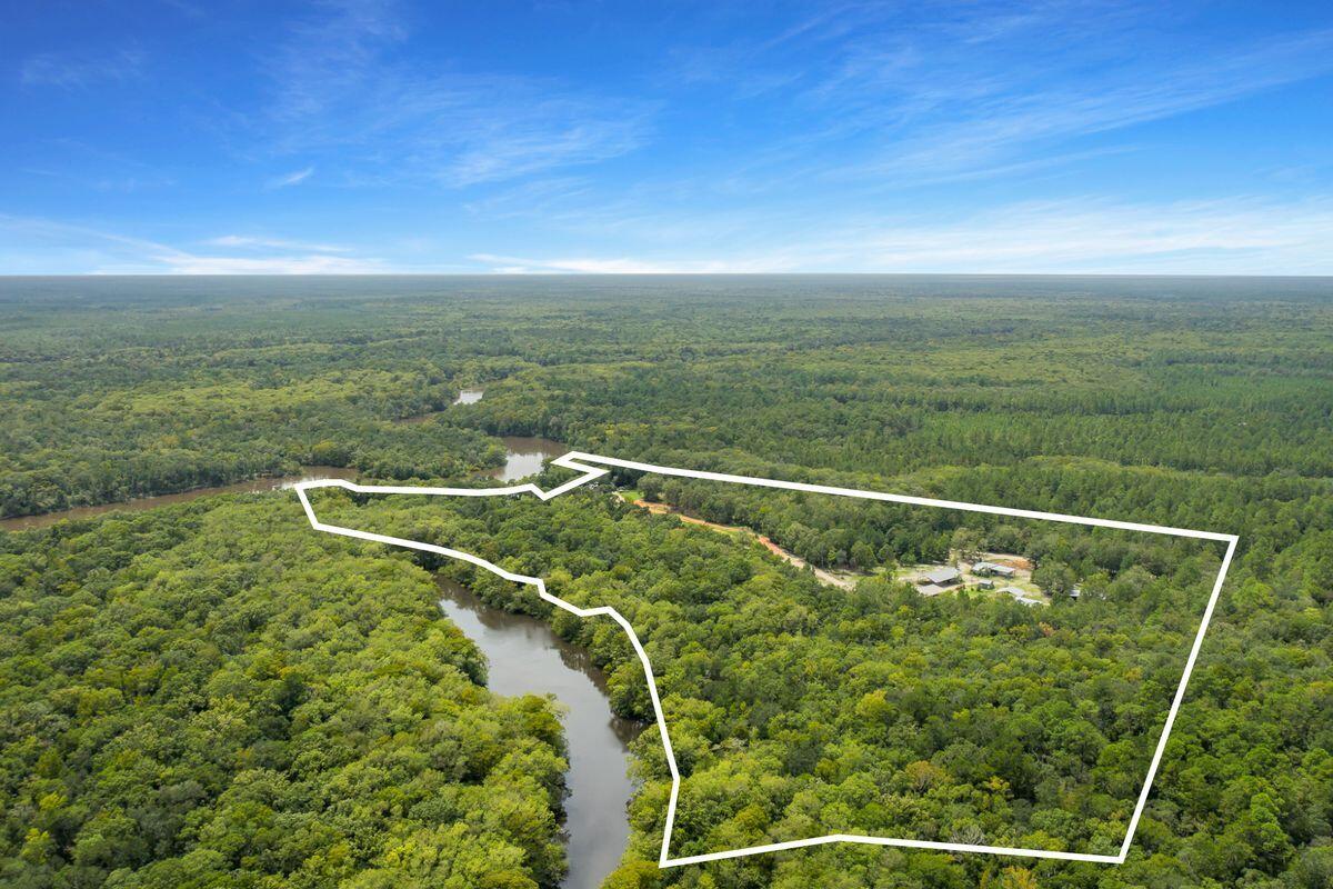 Welcome to a rare opportunity on the Choctawhatchee River, where approximately 49 acres of breathtaking natural beauty are already positioned for future development. A planned and platted 44-lot subdivision is in place, along with nearly eight acres designated for commercial use--offering exceptional potential for investors, builders, or those looking to create a thoughtfully designed riverfront community. Additional land is also available, further expanding the possibilities. Beyond its development appeal, the property offers an incredible setting for personal enjoyment. Towering cypress and oak trees, some more than a century old, frame the landscape, while the gentle flow of the river creates a peaceful, private backdrop. Imagine casting a line from the riverbank or envisioning a Tom Sawyer-style campground or riverside retreat where families gather, make memories, and reconnect with nature.

Located in Bruce, the property offers convenient access to County Park, State Highway 20, and is just a 30-minute drive to Northwest Florida Beaches International Airport. The white-sand beaches of Destin and 30A are also within reach, offering a seamless balance of riverfront tranquility and coastal access.

Whether you're envisioning a large-scale development or a private waterfront escape, this property delivers both scale and opportunity in one remarkable setting.