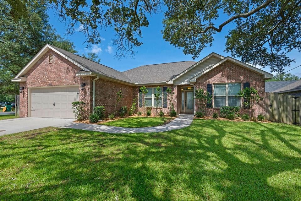 This stunning 4-bedroom, 2-bathroom home offers an expansive 1855 square feet of living space, ideal for creating lasting memories. Step inside to find a beautifully designed interior, featuring elegant granite countertops that add a touch of luxury to your culinary adventures. The open floor plan seamlessly connects the inviting living spaces, perfect for entertaining family and friends. Large windows throughout the home fill each room with an abundance of natural light, creating a warm and welcoming atmosphere. Unwind in the spacious bedrooms, each offering comfort and tranquility after a day of coastal adventures. Lawn Service is included! With an approved pet application, owner will allow fully grown dogs or cats up to 25 lbs or less with a $350 non-refundable pet fee for each pet. Residents are enrolled in the Coastal Realty Services Resident Benefits Package (RBP), which includes renters' insurance, HVAC air filter delivery, a resident rewards program, and more!