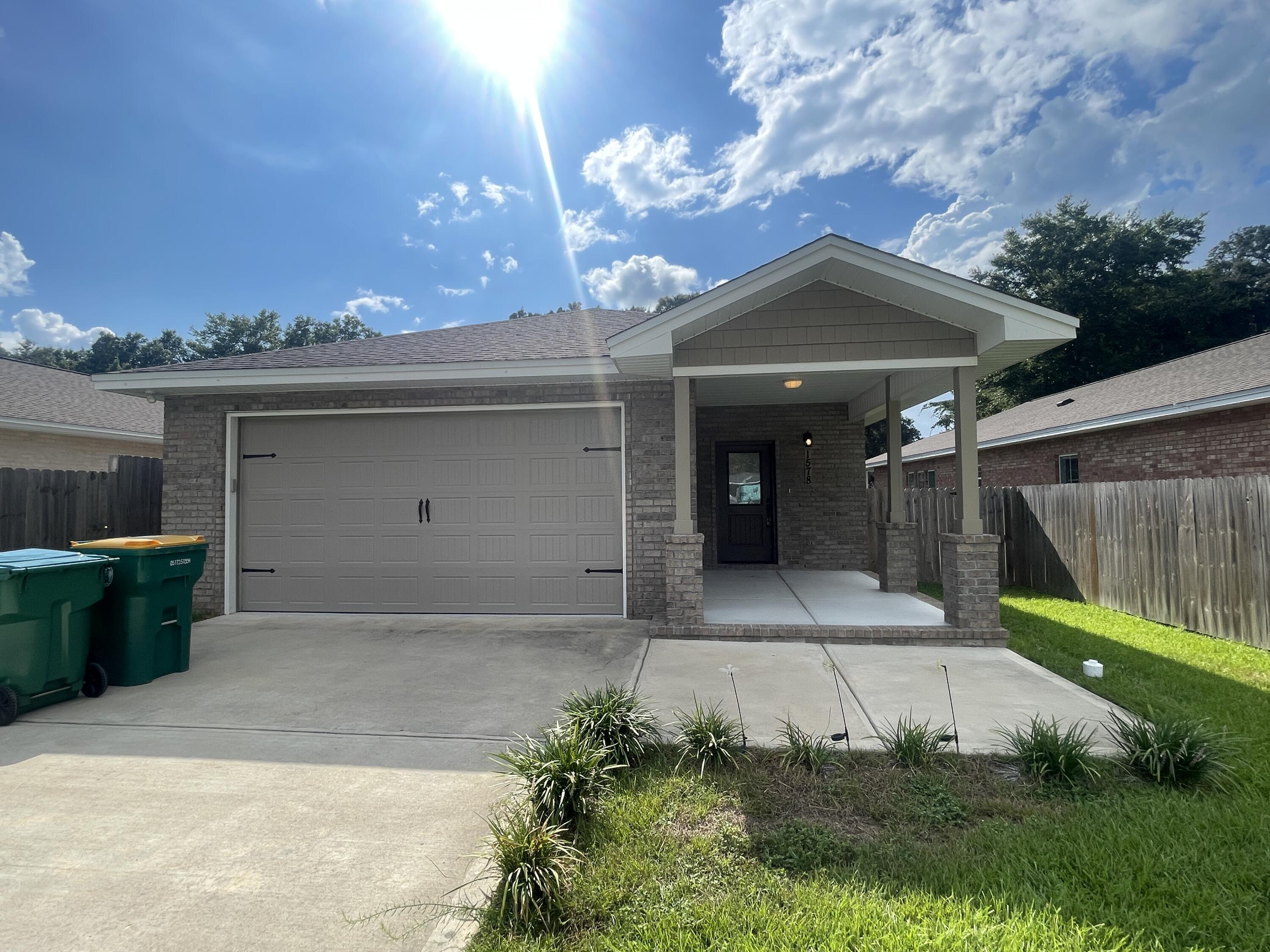 Welcome to this beautifully maintained 3-bedroom, 2-bathroom home, built in 2021 and offering the perfect combination of modern style, comfort, and convenience. Ideally located just minutes from local military bases, within walking distance of the elementary school, and with quick access to the Mid-Bay Bridge, this home places you close to beautiful beaches, shopping, dining, and entertainment.

From the moment you arrive, you'll appreciate the home's inviting curb appeal, highlighted by a charming covered front porch and a spacious, privacy-fenced backyard with a covered patio, creating the perfect space for relaxing, entertaining, or enjoying Florida's beautiful weather. A two-car garage provides plenty of room for parking and additional storage.

Inside, the bright and open floor plan is filled with natural light and showcases recessed lighting, contemporary finishes, and neutral colors that complement any décor. The spacious living area flows effortlessly into the dining area and the beautifully appointed kitchen, featuring granite countertops, stainless steel appliances, a large center island with breakfast bar seating, abundant cabinet space, and a convenient pantry.

The private primary suite is thoughtfully situated at the rear of the home and offers a peaceful retreat with a spacious bedroom, dual vanities, a walk-in shower, and a well-designed en suite bathroom. Two additional guest bedrooms are generously sized and share a full bathroom, providing comfort and  flexibility for family members, guests, or a home office.

Pets may be considered with prior owner approval and a non-refundable pet fee. Smoking and vaping are not permitted.

This exceptional home offers modern living in a highly desirable location, making it an outstanding rental opportunity. Schedule your private showing today!