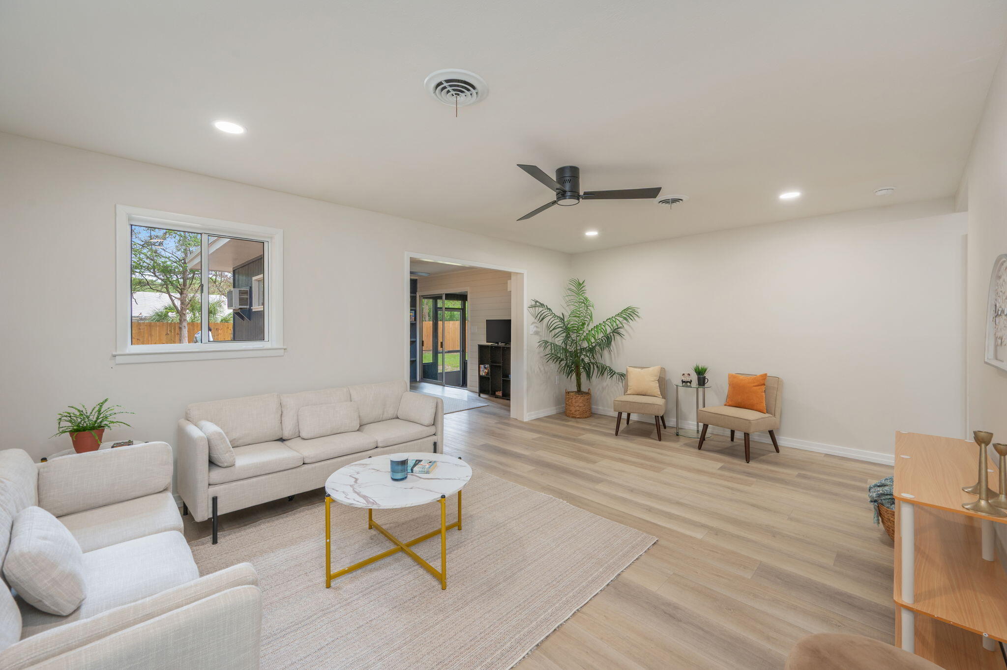 Located in the heart of Fort Walton Beach, this beautifully remodeled 3-bedroom, 2-bath home offers the perfect blend of warmth, comfort, and convenience. Situated on a large lot, this move-in ready home features a desirable split floor plan with two spacious living areas, including one with stunning wall-to-wall built-in shelving that adds both charm and functionality. Recent updates include luxury vinyl plank flooring throughout, new stainless steel appliances, completely renovated bathrooms, updated lighting and ceiling fans, fresh interior and exterior paint, and a newly installed privacy fence. The warm honey-brown wood cabinetry creates a cozy, inviting atmosphere throughout the home. Enjoy relaxing evenings or entertain family and friends in the oversized screened-in sunroom overlooking the spacious backyard. Ideally located near shopping, schools, and both military bases, this home is also less than half a mile from Cinco Bayou and only 15 minutes from the beautiful Emerald Coast beaches. This home truly has it all!  Don't miss your opportunity to own this beautifully updated home in an unbeatable location -- schedule your private showing today and come experience all the warmth and charm this home has to offer!