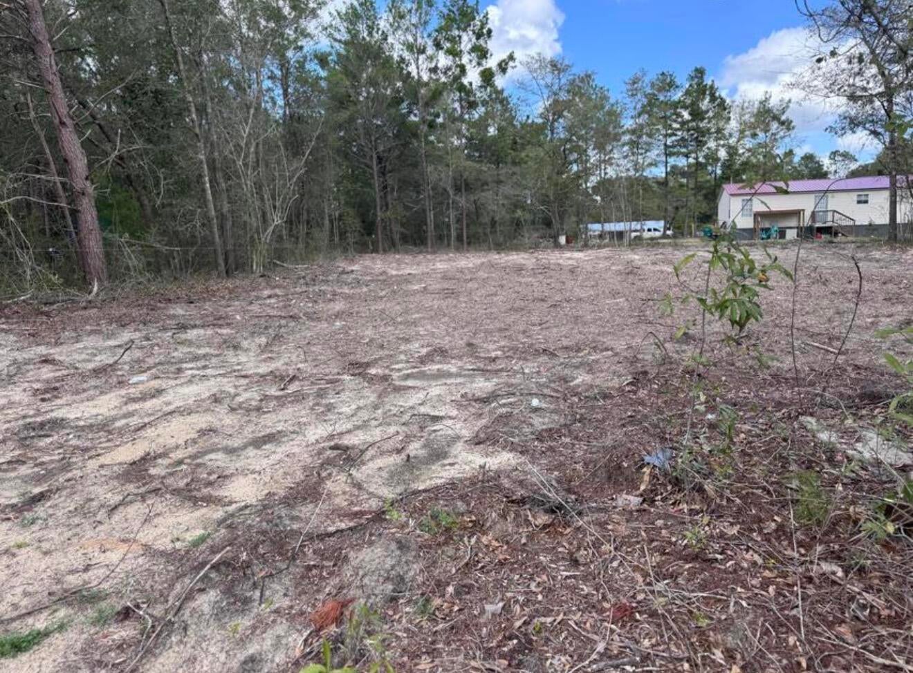 Flat, cleared lot with easy access to water and power. It will need a septic tank as sewer connection is unavailible in this area. Manufactured homes are allowed. Survey is available. Lot is .23 acres & 80ft wide by 125ft deep. Great Investment!