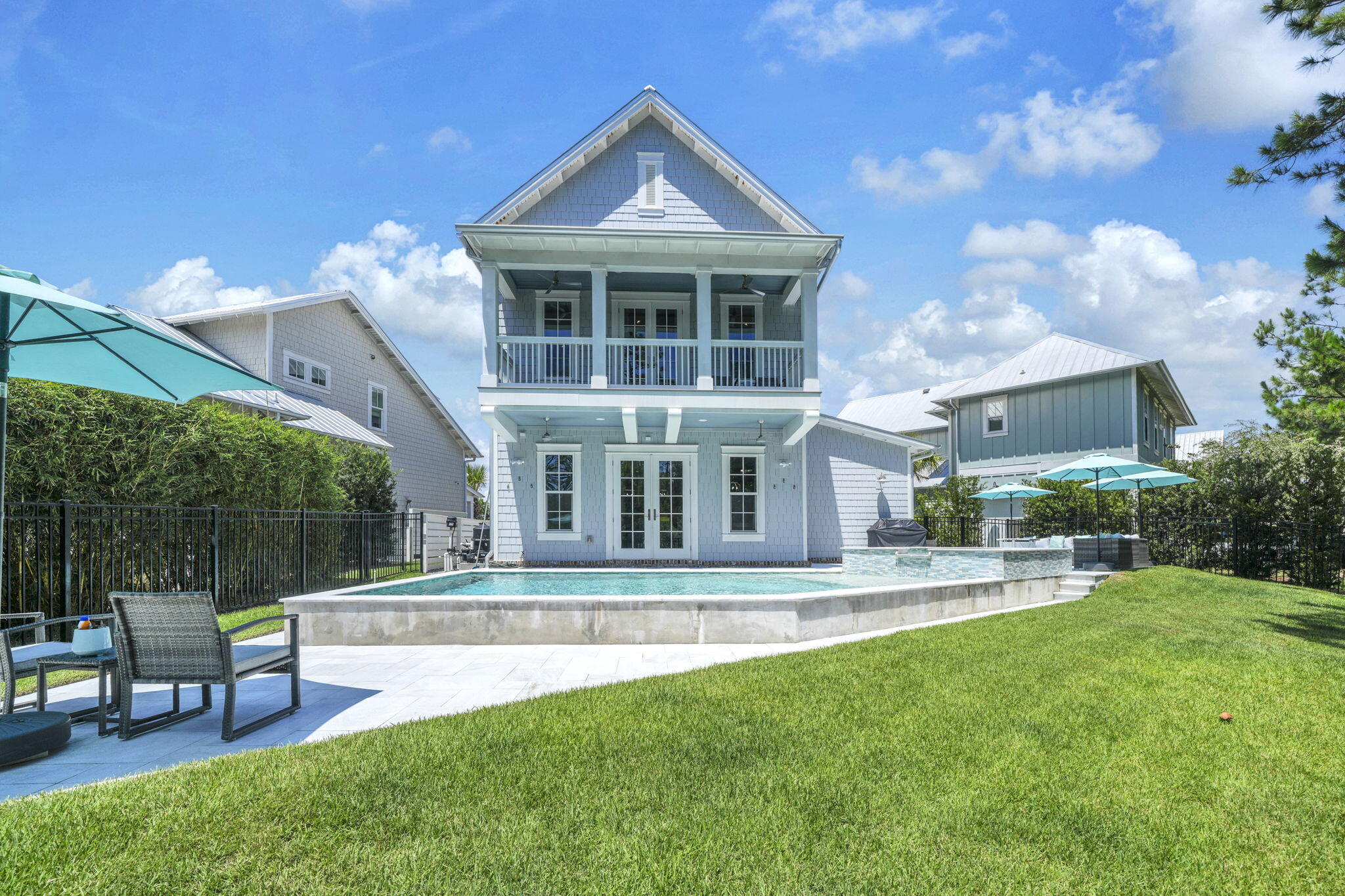 Elegant 5 bed, 4.5 bath 30A Beach Home w/ LARGE Private Swimming Pool & Hot Tub in the Gated Community of Cottage Grove!  With flexibility of a 6+ Month Rental (Pets Negotiable) this move-in-ready & FURNISHED home is ideal for those relocating or building a home in the area! Enjoy a Custom-Built Home featuring a Chef's Kitchen equipped with KitchenAid Appliances, Large Island with Breakfast Bar, and large Pantry!  The Main floor features 10' Ceilings and an Open Concept living/dining room accented by Coffered Ceilings! This Stunning Interior overlooks the Peaceful, PRIVATE Backyard, Swimming Pool and State Forest!  The First-Floor Junior Ensuite has access to the front patio and bed swing to enjoy the views of the pond & fountain!  Addl 4 more beds & laundry upstairs. Primary Bedroom with Tongue and Grove Wood Vaulted Ceiling along with a Private Balcony overlooking the Pool and Forest. The Primary Bathroom features a Soaker Tub, Tiled Shower, Double Sinks & Built in Dressing Vanity.   The two front beds have access to baths & balcony with pond views.  The 5th bed is currently being used as an ofc.  A one-car garage & attic provide ample storage, plus 3 additional parking spaces! 
You can Walk, Bike, or Take a Golf Cart to 30A, Gulf Place, Ed Walline Beach Access, Golf Course, Shopping, Dining & More! With no short-term rentals allowed, Cottage Grove, offers a sought after quiet and relaxing coastal lifestyle in one of 30A's most desirable communities!