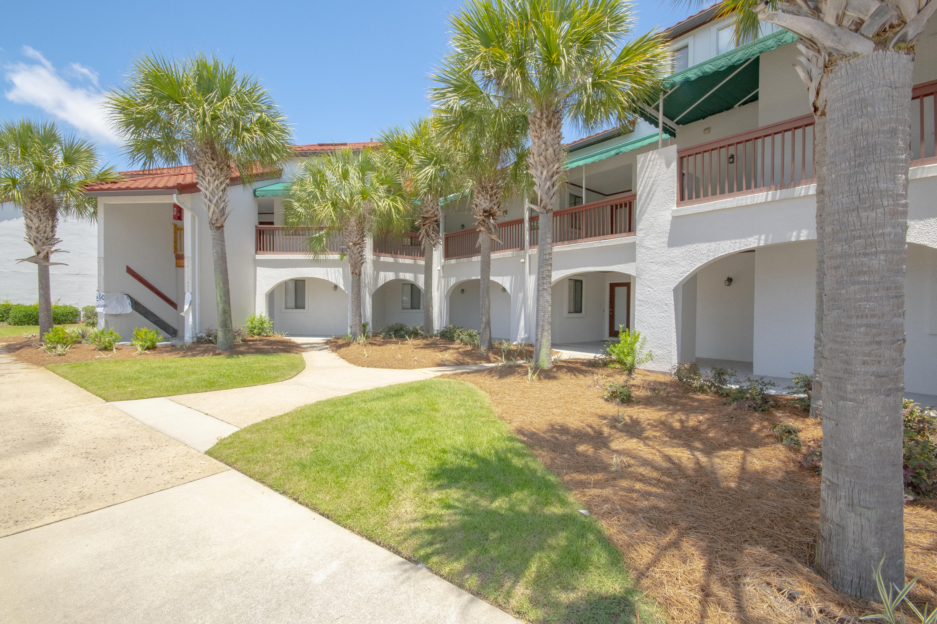 WATERFRONT...Do you have a boat?? Lagoon Waterfront living at its best! This beautifully maintained 2 bedroom, 2 bath condo overlooks the stunning Lagoon with direct access leading to the Gulf and Bays -- a true paradise for fishing and boating enthusiasts. Enjoy breathtaking water views from your private balcony while relaxing in the coastal breeze. This community offers wonderful amenities designed for relaxation and fun, including a boat dock, boat parking, pool, sauna, community room, picnic area, tennis and pickleball courts, dog walking area and 1.5 blocks to the spectacular white sandy beach and Emerald Green Gulf Water. Conveniently located near popular restaurants, local bars, shopping, and family entertainment, making it perfect as a primary residence, vacation getaway, or investment property. Experience the perfect blend of coastal charm, recreation, and convenience all in one incredible location! MUST SEE!!!