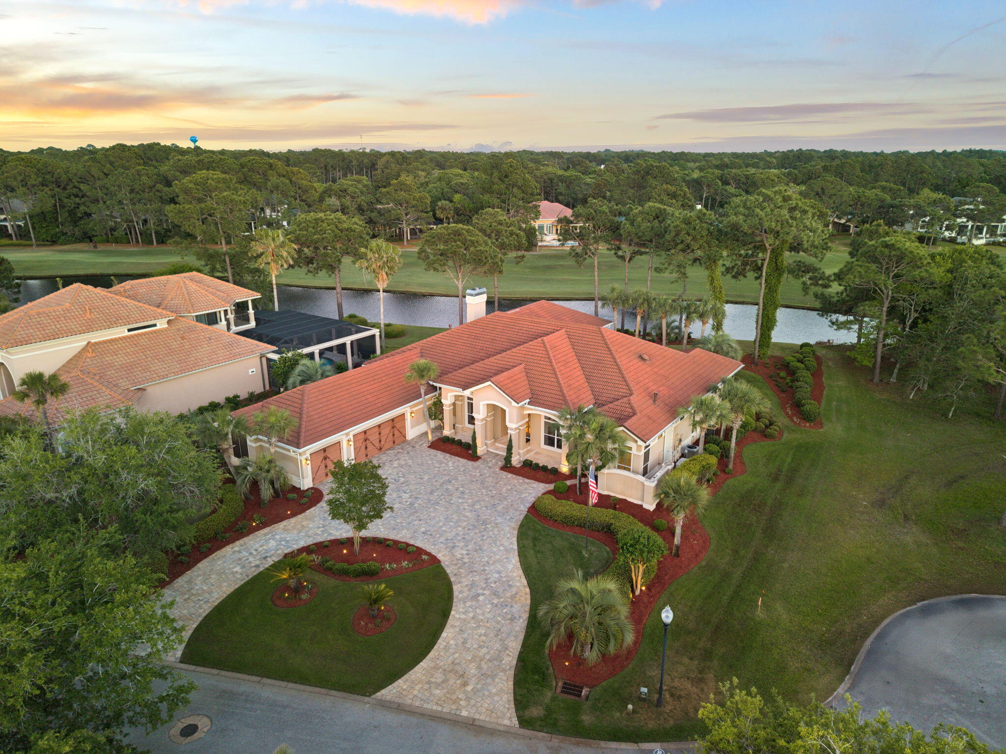 Welcome to 3234 Bay Estates, an exceptional offering within the exclusive Burnt Pine enclave of Sandestin. Perfectly positioned along the 13th fairway, this beautifully updated residence captures sweeping lake and golf course views, creating a private and serene backdrop that defines elevated coastal living.
Spanning nearly 5,200 square feet, the home presents a thoughtfully curated layout designed for both elevated entertaining and relaxed daily living. From the moment you enter, a formal sitting room commands attention as the central focal point, framed by expansive windows and glass doors that showcase the home's exceptional outdoor living spaces and panoramic golf course views. Flanked by an elegant formal dining room and a well-appointed private office, this striking introduction sets the stage for the home's refined design and effortless flow.
An expansive, fully enclosed Florida room and summer kitchen span the entire rear elevation, a defining feature of the home. Designed for year-round enjoyment, this space is fully air-conditioned and seamlessly connects to the outdoors through retractable glass doors and motorized screens, creating a truly fluid indoor-outdoor living experience. The summer kitchen is exceptionally well-appointed, featuring an Alfresco grill with side burners, Big Green Egg, dishwasher, beverage refrigeration, extensive cabinetry, and a striking statement hood. A stunning gas fire table with seating for eight and a fireplace with a concealed television complete the space, offering a warm and inviting setting for both relaxed evenings and refined entertaining.
Beyond, the open-air pool terrace reveals a heated pool and spa with fountain features, perfectly positioned to capture sweeping views of the golf course and surrounding lakes. Framed by mature landscaping and accented with gas lanterns and coastal elements, the outdoor living space feels both private and resort-inspired, creating a serene backdrop for everyday living.
Inside, the chef's kitchen is both refined and highly functional, thoughtfully designed to anchor the home's main living spaces. Appointed with premium appliances including DCS double ovens, a Dacor gas cooktop, SubZero refrigeration with custom paneling, and a warming drawer, the space is centered around a substantial island featuring discreet, built-in power: easily accessible when needed and seamlessly concealed when not. Distinctive brick flooring adds warmth, texture, and character, creating a custom feel that truly sets the kitchen apart.
Designed for both gathering and flow, the kitchen transitions effortlessly into a casual dining area and the adjoining living room, creating an inviting and connected environment. The living room offers a cozy yet elegant atmosphere, highlighted by a newly updated fireplace framed by custom built-ins with generous display space. Expansive sightlines extend through the Florida room to the outdoor living spaces and sweeping views beyond, allowing the home's natural surroundings to become part of the experience. A thoughtfully positioned wet bar with wine storage and ice maker, located just off the kitchen, completes the space and enhances its role as a central hub for entertaining.
Each of the three bedrooms feature plush new carpeting and are privately appointed with their own ensuite bath, offering comfort and privacy for both residents and guests. The primary suite is a true retreat, designed for both relaxation and quiet luxury. Generously sized, the bedroom features a dedicated sitting area and direct access to the Florida room, creating a seamless connection to the home's serene outdoor setting. The ensuite bath is equally well-appointed, offering dual vanities, a jacuzzi tub, a separate walk-in shower, and dual closets for ample storage. A recently expanded guest suite now serves as a junior primary, complete with a walk-in closet and a beautifully designed bath with dual sinks and an oversized tiled shower.
The three-car garage is a standout feature in its own right, thoughtfully finished with air conditioning, brick flooring, and custom built-in storage that elevates both form and function. Designed with the same attention to detail found throughout the home, the space offers a clean, organized, and comfortable extension of the living environment.
Additional highlights include a spacious mudroom and laundry area just off the garage, complete with custom cabinetry, generous counter space, and additional refrigeration for added convenience. The home is further enhanced by three recently updated HVAC systems, a newly installed gas water heater, and a whole-home sound system. A dedicated water treatment system helps preserve exterior surfaces from staining, offering both practical value and long-term peace of mind. Hurricane shutters are also in place for the main residence.
Spanning over 2,400 acres from the bay to the beach, Sandestin Golf and Beach Resort offers miles of golf cart and pedestrian pathways winding through lush landscapes and along scenic lagoons, seamlessly connecting an array of world-class amenities. Residents enjoy access to championship golf, tennis and pickleball, miles of biking and walking trails, and a 210-slip full-service marina, along with the vibrant The Village of Baytowne Wharf for dining, shopping, and year-round events. Just a short golf cart ride away, Grand Boulevard and the Market Shops at Sandestin offer a curated mix of dining, retail, entertainment, and everyday conveniences.
Together, it's a lifestyle defined by ease, connectivity, and the very best of coastal living.