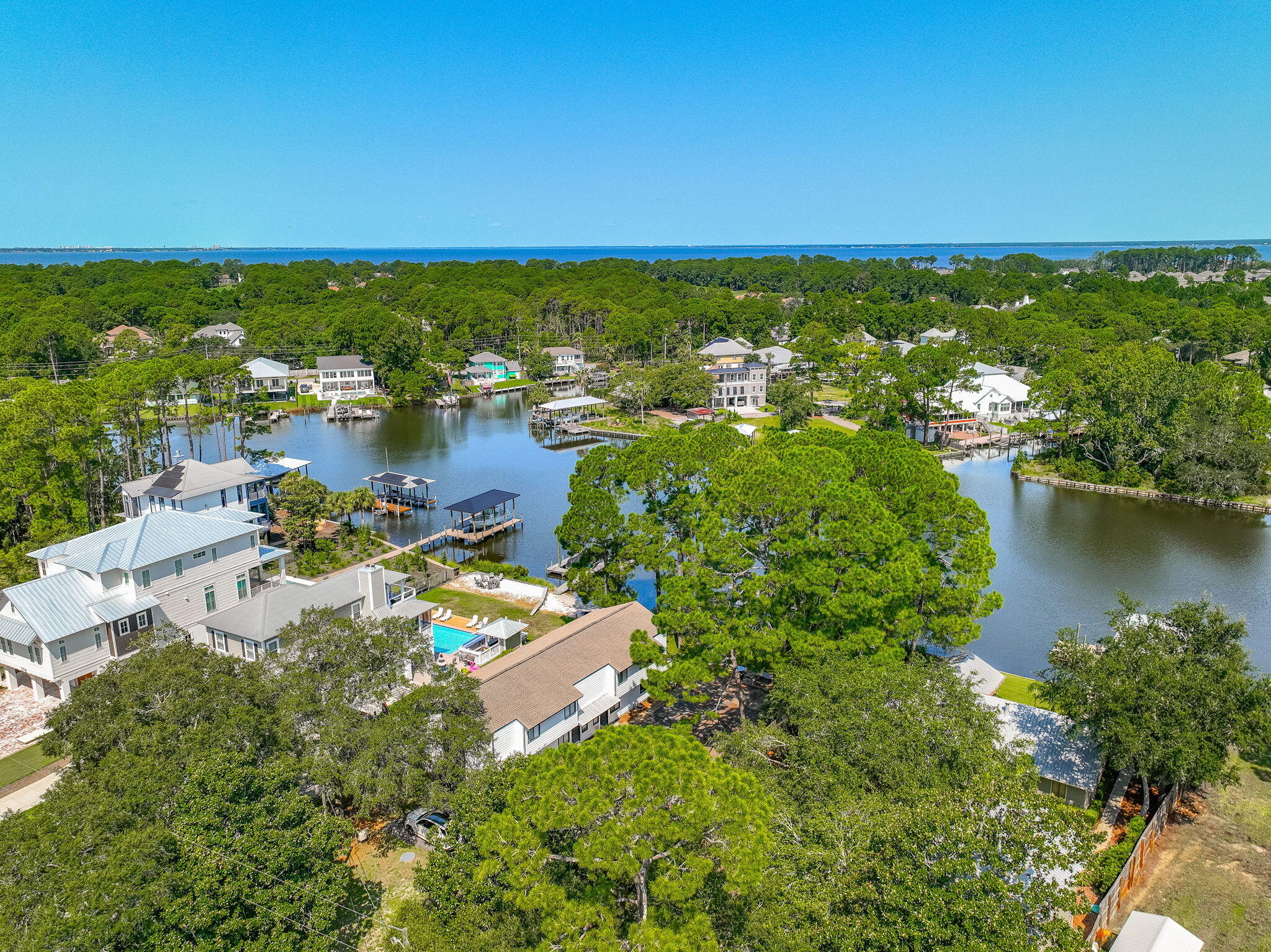 Renovated Buck Bayou water front unit with boat dock that hasn't been on the market in over 30 years! Located in a Waterfront four-plex with shared dock on Buck Bayou that leads directly to the bay! Unit has a deep water and deeded boat slip. Boat slip will hold appx. 24 foot boat with the draft being 4 to 5 feet. Development has 98 feet directly on Buck Bayou. Renovated 2 bedroom 1 1/2 bath with new paint, LVP flooring, hot water heater, updated kitchen with new appliances, and renovated bathrooms.  Large deck looking out on the Bayou. Located in the popular and fast growing area of Mack Bayou and with close proximity to Sandestin. Perfect for a 2nd home or a week-end getaway.   Property has rented for $2500 a month and boat slip has rented for $300 a month.
