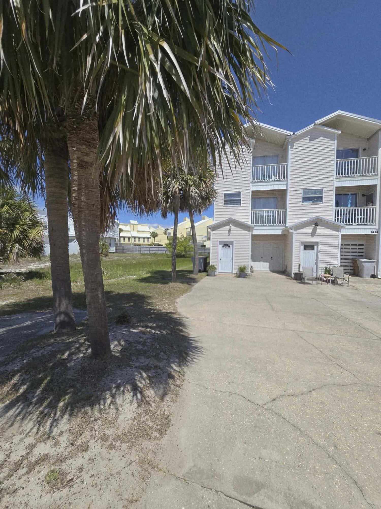 Coastal Investment Opportunity - End-Unit Townhome with Bonus Apartment | Sleeps 8

Welcome to your ideal beachside retreat and income-producing opportunity! This 2-bedroom, 3.5-bath end-unit townhome offers a versatile layout with a private ground-level mini-apartment, bringing the total sleeping capacity to 8 guests comfortably.

The separate-entry mini-apartment features its own full bathroom, kitchenette with stove, dedicated AC unit, and sleeper sofa--perfect for guests, extended family, or maximizing short-term rental income.

The main living level is designed for entertaining with an updated kitchen showcasing new sinks, microwave, breakfast bar, and stylish lighting. Enjoy a spacious living area with sleeper sofa, half bath, and front and rear decks with full sliding glass doors for seamless indoor-outdoor living.

Upstairs, you'll find two generously sized bedrooms, each with private en-suite bathrooms. The primary suite features a king bed, while the guest room offers two twin beds. A bonus office nook adds flexibility for remote work or additional guest use. Both upper and main levels include private decks, bringing the total to five outdoor spaces to soak in the coastal breeze.
Located just steps from the sugar-white sands and emerald waters of the Gulf, and within walking distance to local favorites for dining, live music, and waterfront fun. This property delivers both lifestyle and strong rental potential.

Whether you're looking for a personal beach escape, a turnkey investment, or a hybrid of both, this one checks every box.
