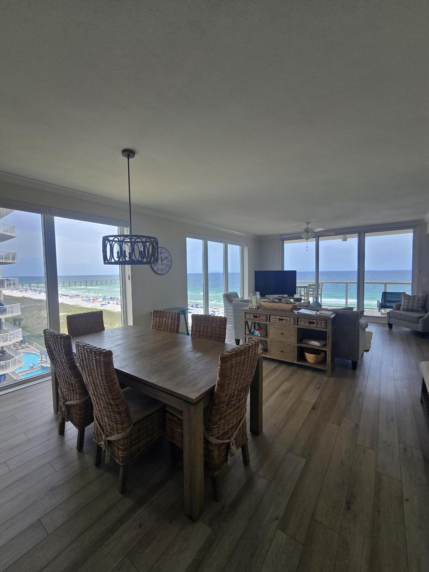 You have discovered your Gulf front oasis on beautiful Navarre Beach!
 
Welcome to 8477 Gulf Blvd, an exceptionally renovated, fully furnished condo offering modern comfort and breathtaking coastal living on Navarre Beach. Desirably situated on the 6th floor and east corner of the building, this spacious 1,824-square-foot residence will stun you with unforgettable Gulf and Navarre Beach Pier views the moment you enter. This unit boasts 3 full ensuite bedrooms and 3 bathrooms - one a possible lock out unit - providing ample space for separation, relaxation and hosting guests.

This condo has undergone a total renovation, featuring elegant LVP floors throughout; a soothing pallette; gorgeous window treatments (including automatic shades); high end coastal furnishings and finishes; plus, all around inviting natural light with floor to ceiling windows. The kitchen is thoughtfully updated with a breakfast bar, pantry, stainless steel appliances/ finishes and coastal inspred backsplash. The dining area further enhances the coastal charm with the large table and coastal chic chandelier, offering an ideal setting for meals with an incredible view. Bathrooms offer luxurious tiled showers/ tubs, and bedrooms are tastefully decorated with modern touches.

Step onto your private Gulf front balcony and take in the stunning views while enjoying peaceful moments outdoors, complete with gentle breezes and possible sightings of the vibrant marine life in the Gulf. The balcony is accessed via the living area and the primary suite. A separate balcony offers a lovely waterfront view of the Santa Rosa Sound from the 3rd bedroom and possible lock out unit. 

For your convenience, the condo includes an in unit washer and dryer and recently replaced AC and hot water heater. Building amenities include an elevator and  a sparkling pool, perfect for unwinding after a long day.

Located directly on the Gulf, this beachside condo is perfectly designed for both everyday living and a luxurious retreat. Whether you're relaxing inside or relishing the outdoor serenity, this condo encompasses everything you need for the ultimate coastal lifestyle. Don't miss the chance to make this incredible property yours--schedule a showing today!
