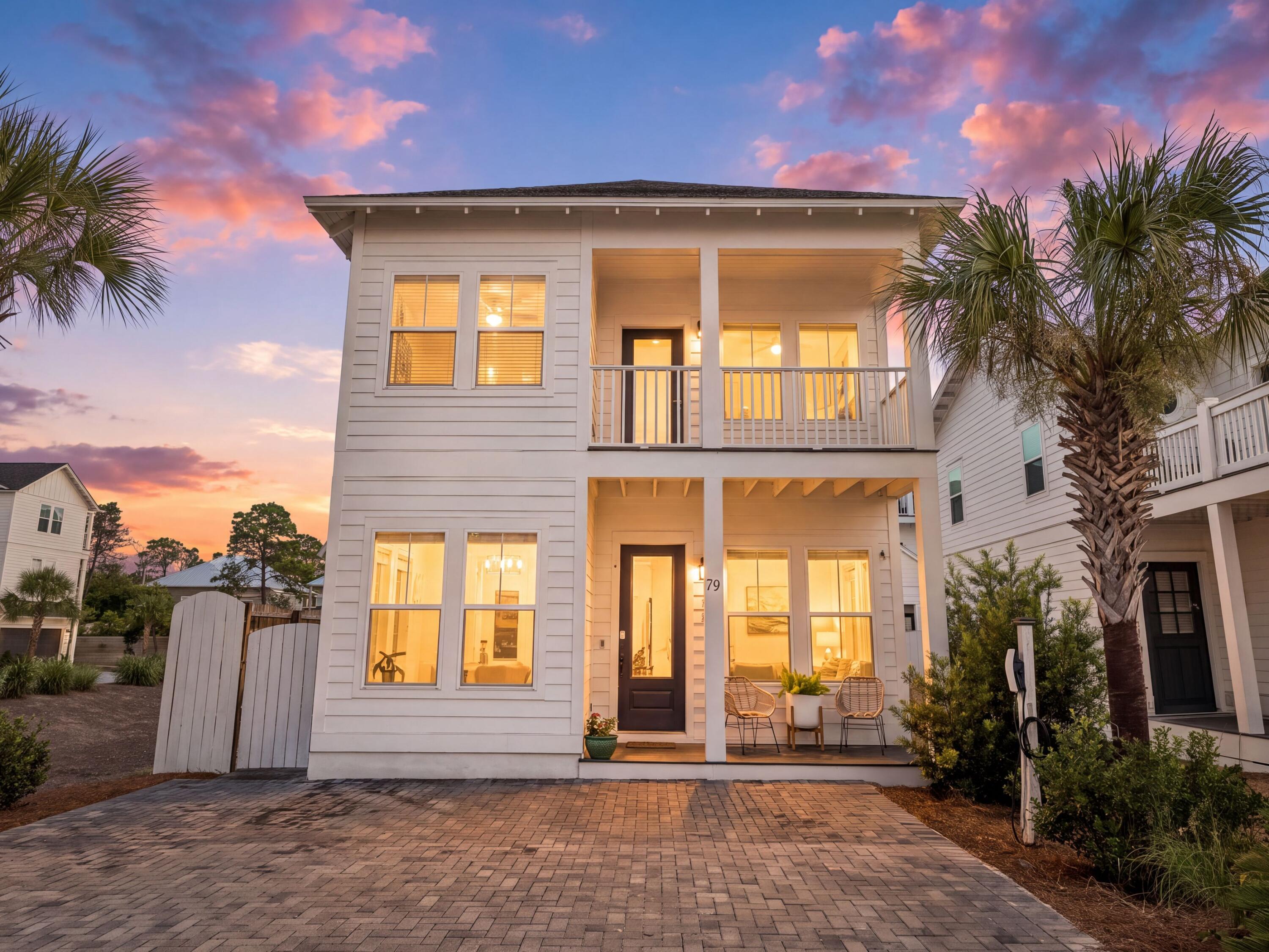 A home should make everyday life feel effortless, and this beautifully appointed residence at The Ivy at Inlet Beach does exactly that. Positioned on a desirable corner homesite with no neighboring home to one side, the property enjoys added privacy, abundant natural light and an airy coastal feel throughout. Thoughtfully designed with flexible living spaces and stylish finishes, it offers an exceptional opportunity as a full-time residence, second home or vacation rental investment in one of Inlet Beach's fastest-growing areas.

The four-bedroom, three-and-a-half-bath home features a spacious open-concept floor plan designed for gathering and entertaining. The living and dining areas flow seamlessly into a well-appointed kitchen complete with modern finishes, a walk-in pantry and generous workspace for everyday meals or hosting friends and family. Shiplap accents throughout the home add subtle coastal character while maintaining a clean, contemporary aesthetic. A rare first-floor bedroom with a private ensuite bath provides outstanding flexibility, serving equally well as a guest suite, second primary bedroom or private office. Upstairs, the spacious primary suite offers a relaxing retreat with a spa-inspired bathroom, while two additional guest bedrooms provide comfortable accommodations for family and visitors.

Practical upgrades enhance daily living, including an electric vehicle charging outlet compatible with Tesla vehicles and thoughtfully updated finishes that create a light, bright interior ready to enjoy from day one.

Residents enjoy a community swimming pool and the convenience of a pedestrian tunnel providing easy access beneath U.S. Highway 98 to Scenic Highway 30A. From here, Inlet Beach's sugar-white sand beaches, Watersound Town Center, 30Avenue, Rosemary Beach and an outstanding collection of restaurants, boutiques and entertainment are all just minutes away, making this an exceptional opportunity to experience the best of the Emerald Coast.
