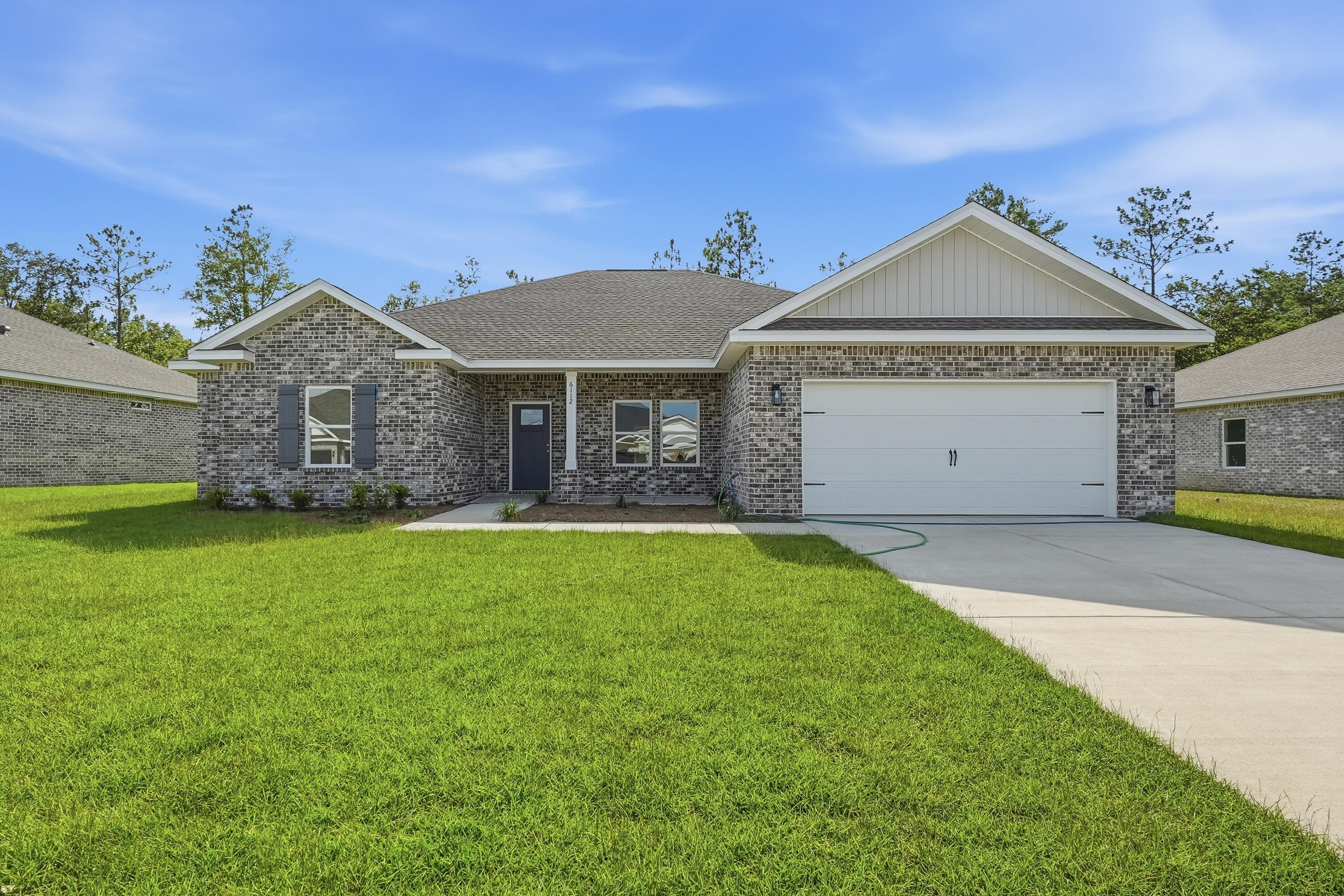 'POPULAR DALTON PLAN' featuring 5BR/3BA WASHER/DRYER/REFRIGERATOR/BLINDS!! All brick, fully landscaped yard, finished garage, front & rear porches for relaxing.  Features: Raised ceilings, walk-in pantry, quartz work island w/bar seating, dining area, walk in closet in owner's suite, walk-in closets in 2 additional BR'S, split BR design, open family gathering area overlooking KT/Dining.  Seller will contribute up to $15,000 towards buyer closing costs (call for details). MUST CLOSE BY AUGUST 31, 2026.  INTERIOR PHOTOS OF SIMILAR SOLD HOME COLORS & FINISHES WILL VARY.