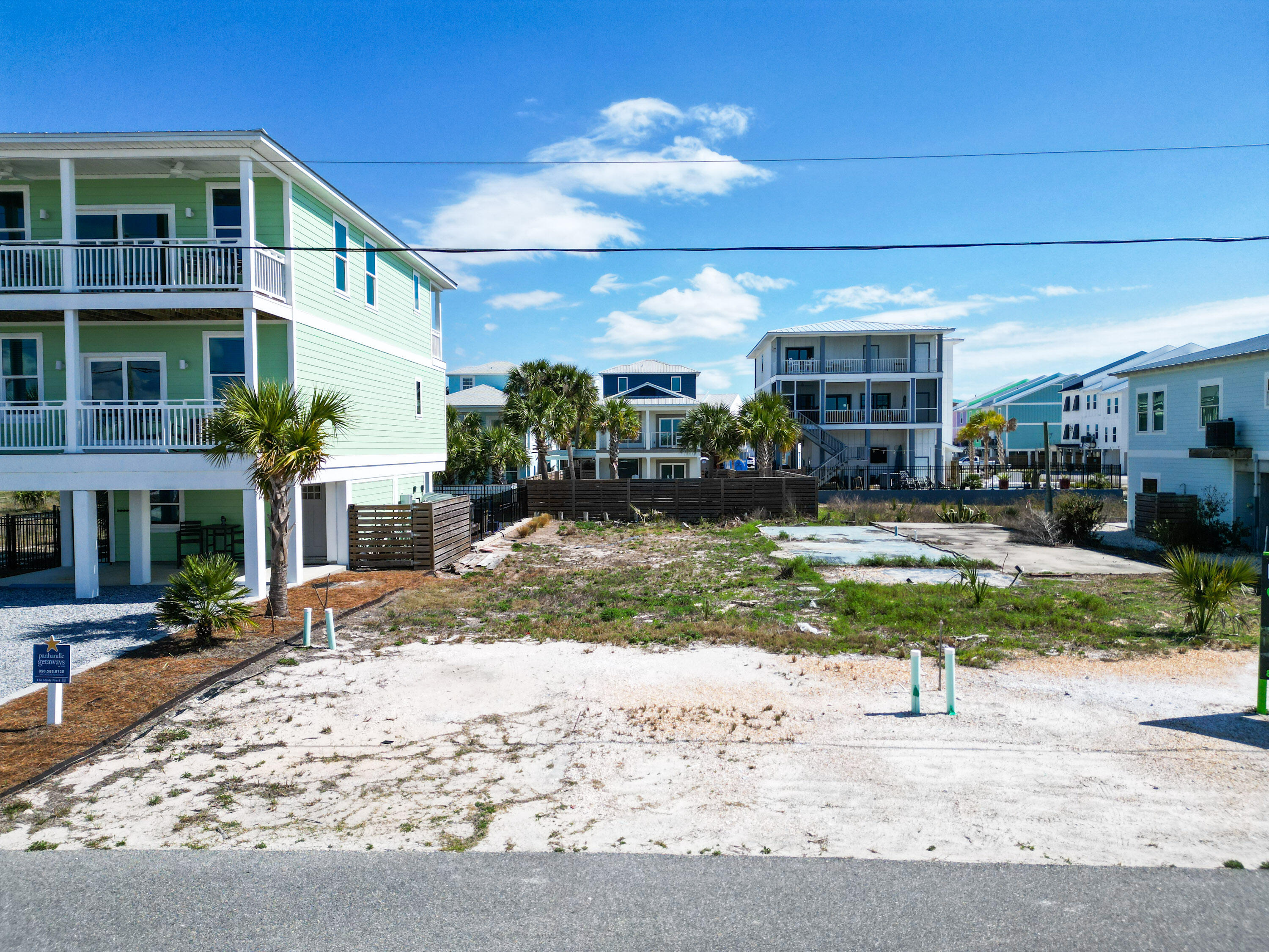 Rare opportunity to own platted lot only 400+/- feet from dedicated access to the beautiful sugar sands of one of the best shorelines in the region. Also, the parcel is located approximately 400 feet from Highway 98 which provides less traffic noise and the safety of not crossing the highway. Water and Sewer Taps Paid per owner. Owner has provided non engineered renderings of potential use, survey, and elevation certificate. Only a couple of streets over from the new municipal pier, 15 minutes from Port St. Joe, and about 15 minutes to Tyndall AFB main gate. Lot C, which is adjacent and owned by the same owner is also for sale and listed MLS #996905. All information deemed reliable but not guaranteed, please verify if important.