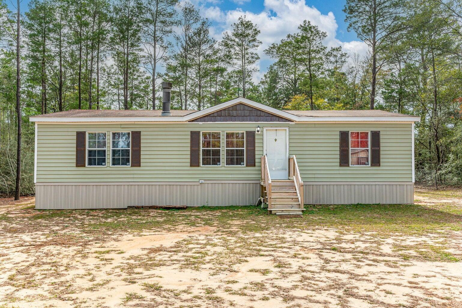 Welcome to your rental opportunity! Discover a charming 1296 sq ft manufactured home nestled on .23 acres of level land. This meticulously cared for residence ensures comfort and efficiency. The shingle roof provides both reliability and style to this inviting abode. Relocated to its current site, where a new septic system was installed, offering hassle-free living to its occupants. Inside, revel in the well-designed layout featuring 3 bedrooms and 2 baths, utilizing a smart split floor plan for added privacy. Application with background & credit check required- requirements are a credit score of 600, one year on the job, and monthly household income of $3750.