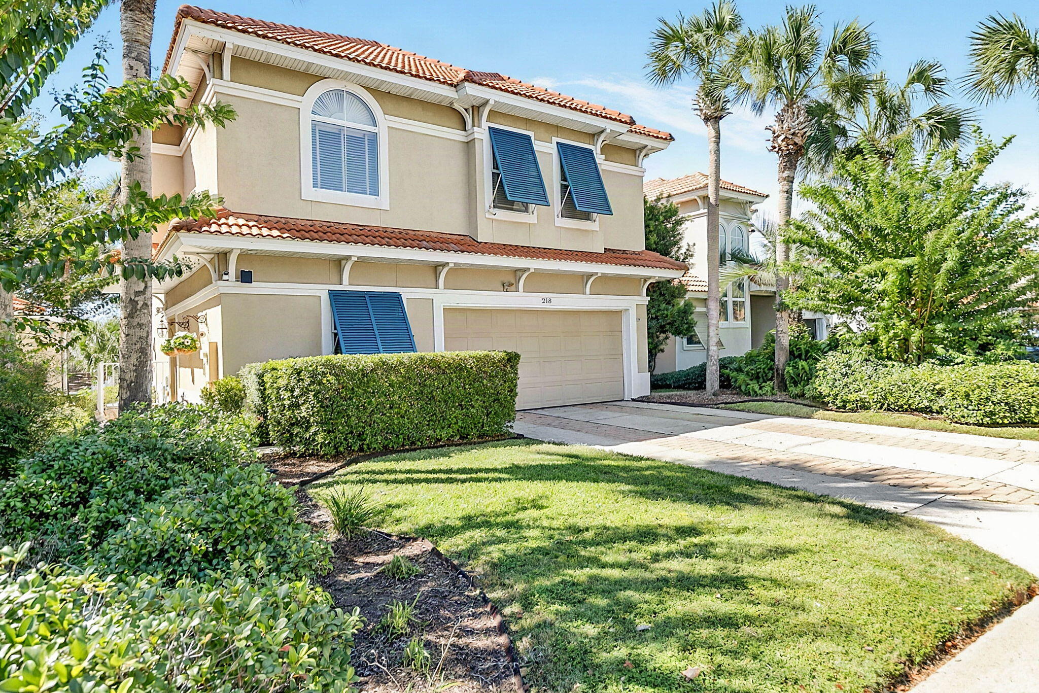 Welcome to 218 Calusa Blvd in the private, gated Calusa Bay community, this offers an amazing location with easy access to the community pool, while backing up to the golf course. Beautiful curb appeal with a paver driveway and lush mature landscaping. Inside the main level features a soaring two-story great room with tile floors, a gas fireplace, and dining space that seamlessly connects to a kitchen complete with granite countertops, tile backsplash, stainless steel appliances, a pantry, and counter seating. Convenient first floor laundry with cabinets and utility sink built in. Upstairs, a second-floor landing loft area with wood floors provides space for an office or seating. The primary suite features wood flooring, a private balcony overlooking the backyard, his-and-hers walk-in closets, and an en-suite bath with a double vanity, whirlpool tub, and separate shower. Two additional bedrooms share a full hall bath. Outside, a screened patio and oversized paver patio sit within a fenced yard backing directly to golf course views. Positioned near Highway 98, minutes from Destin Commons, Silver Sands Outlets, and sugar-white beaches, this home is ideal as a primary residence, vacation retreat, or investment property-all within a neighborhood offering a community pool, covered picnic area, and low HOA fees of just $230 quarterly. Schedule a private showing today!