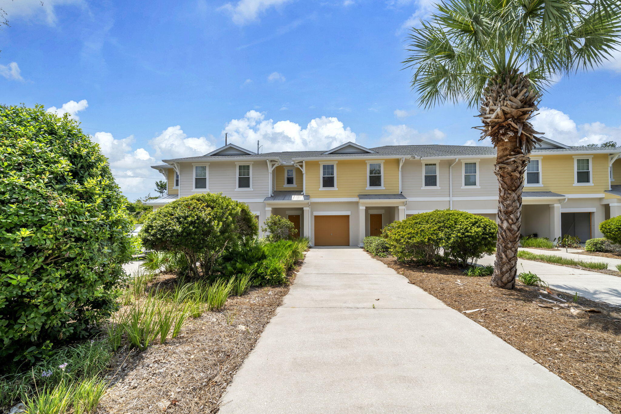 Here is your opportunity in the sought after west end community of Whisper Dunes! This well maintained home is waiting for your personal touches as a primary residence or second home in a community that does not allow short term rentals. Outstanding location close to the beach, and 5 miles to Pier Park to the east, and 5 miles to 30A to the west. The community has a beautiful pool in the back of the community that backs up to conservation land. This Beazer home has quality construction with concrete block on the first floor and hardie siding on the second floor. Exterior was painted in 2025. New roof in 2025. A/C unit was replaced in 2022. Open floor plan with tile flooring on the main level with the kitchen, living and dining area. Kitchen has stainless appliances and solid surface counters. There is a powder bath off the living area. An open patio off the living area offers private outdoor space and extends your living and entertaining space.