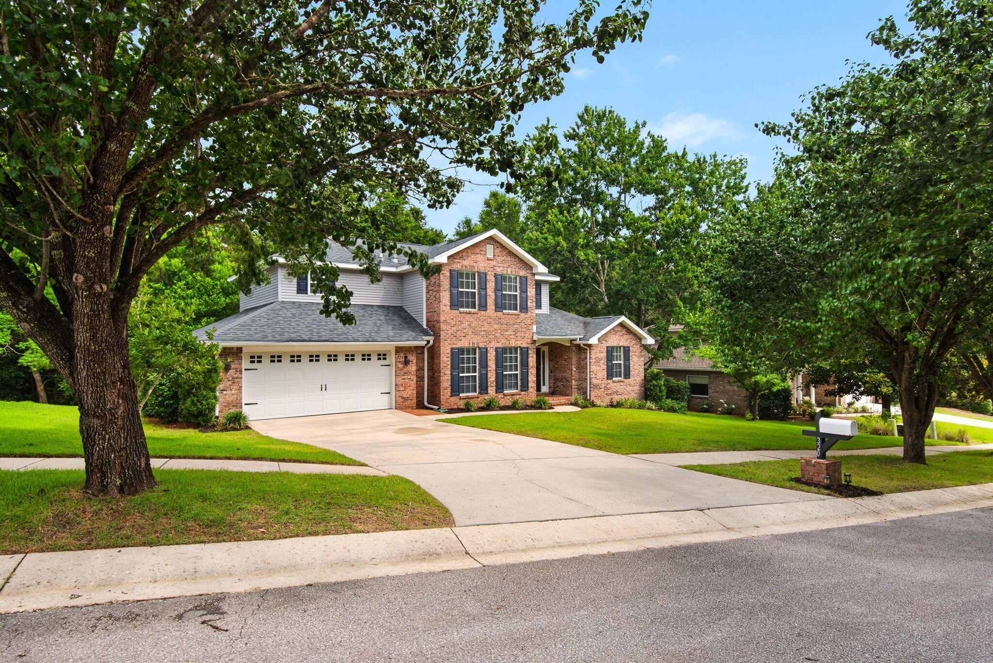 Welcome to 320 Branch Hill Park, where traditional charm meets modern comfort on a picturesque, wooded homesite. Nestled among mature trees, this beautifully updated two-story home offers four bedrooms, two and a half baths, and a thoughtful floor plan designed for both everyday living and effortless entertaining.

The light-filled main living area is warm and inviting, anchored by a cozy gas fireplace and surrounded by serene views of the natural landscape beyond. The updated kitchen is both stylish and functional, featuring quartz countertops, a sparkling tile backsplash, new gas range, walk-in pantry, and a sunny breakfast area perfect for casual gatherings.

The spacious first-floor primary suite provides a private retreat, complete with a beautifully renovated bathroom showcasing modern finishes and thoughtful design with a deep-soaker tub, dual vanity with stone counter top, tiled walk-in shower,  and large walk-in closet. 

Upstairs, three additional bedrooms and a stunning updated full bath offer ample space for family, guests, or flexible use.

Step outside and discover one of this home's most captivating features--a stunning screened in porch and open deck overlooking a peaceful canopy of trees. Whether enjoying your morning coffee, hosting friends, or simply unwinding at the end of the day, this private outdoor setting feels like a secluded retreat.

With tasteful updates throughout, generous living spaces, and a beautiful natural backdrop, this move-in-ready home offers the perfect blend of comfort, character, and privacy in the heart of Niceville.

Roof 2020, WH 2017, HVACs 2021 and 2015