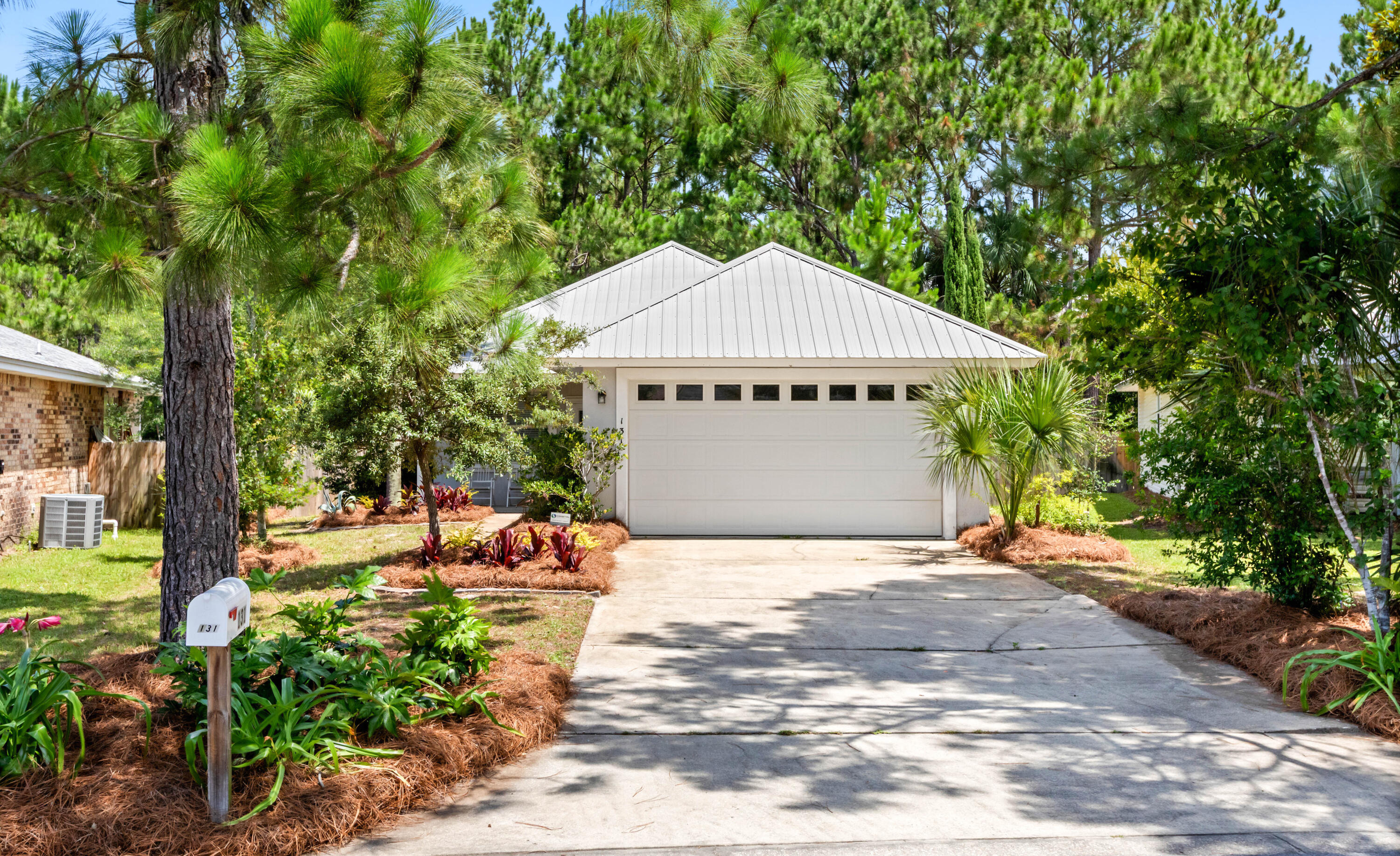 Discover coastal living at its finest in the desirable Emerald Walk community on the west end of Scenic Highway 30A, just moments from beach accesses and the natural beauty of Topsail Hill Preserve State Park. This well-maintained home features an open, spacious floor plan with 9-foot ceilings, creating an inviting atmosphere ideal for both everyday living and entertaining.

The thoughtfully designed interior offers tile flooring throughout the principal living areas and plush carpeting in the bedrooms. The large primary suite serves as a private retreat, complete with an ensuite bath featuring dual vanities and ample storage.

Step outside to the screened lanai overlooking the community preservation area, where peaceful views and abundant wildlife provide a tranquil backdrop. Situated on a generously sized, professionally landscaped lot, the property offers ample space to create your own outdoor oasis.

Additional features include a two-car garage, a new A/C system installed in 2024, and a Coastal Protection alarm and fire security system for added peace of mind. Outdoor enthusiasts will love the nearby Topsail Hill Preserve State Park, offering more than 3 miles of pristine beaches and 15 miles of walking and biking trails.

With no short-term rentals permitted, Emerald Walk provides a quieter, residential atmosphere perfect for full-time residents, second-home owners, or those seeking a peaceful beachside lifestyle.